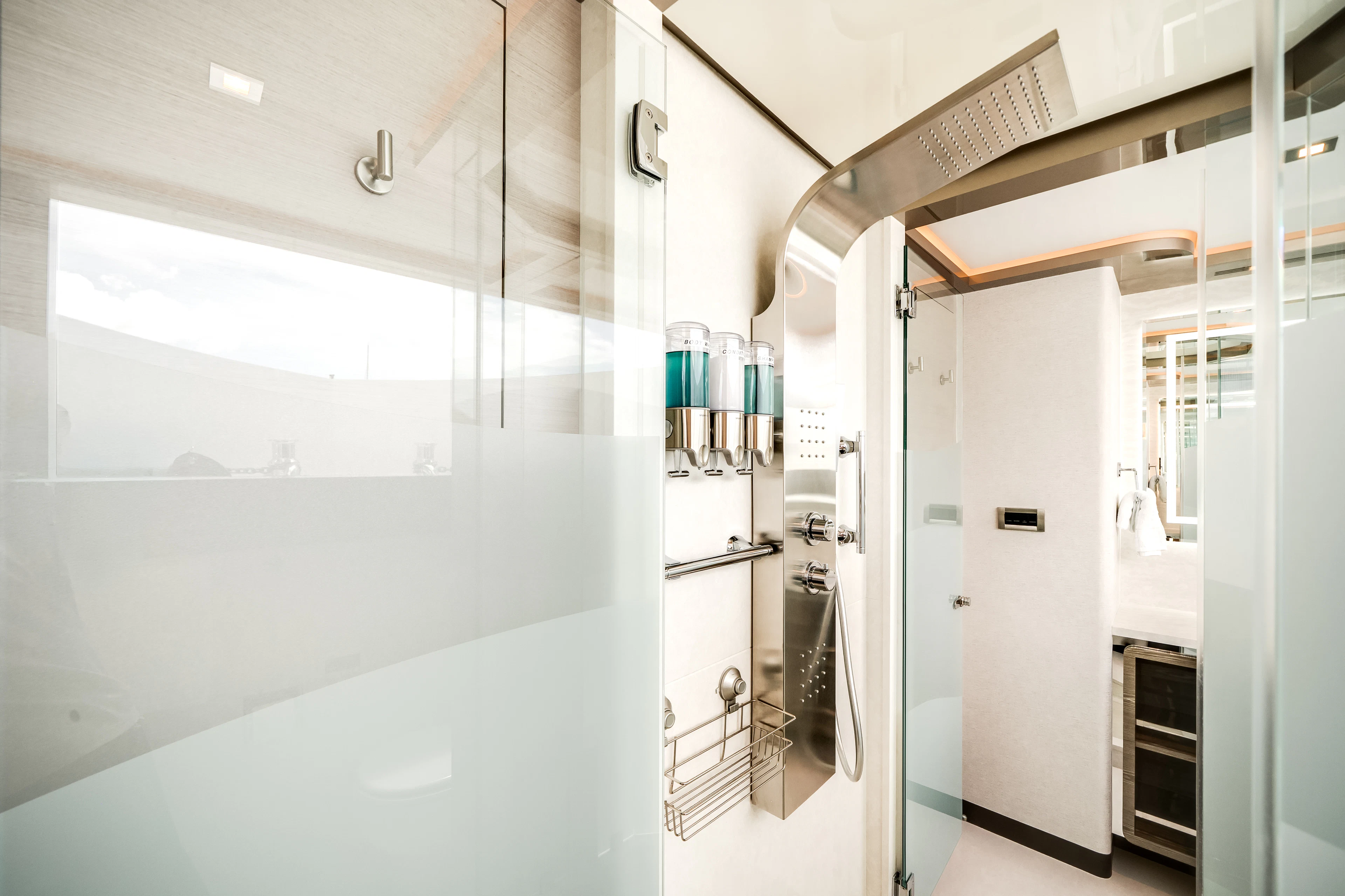 a hallway with a glass door aboard JUST A VACATION Yacht for Sale