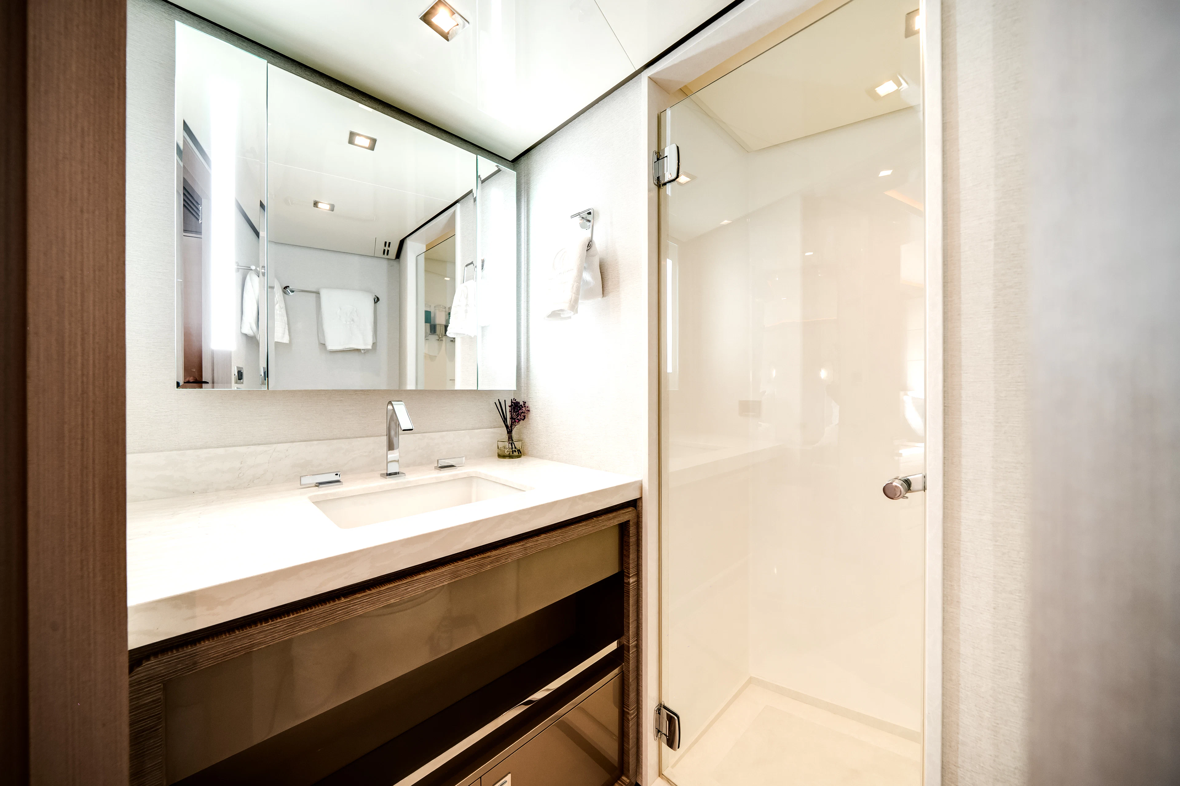 a bathroom with a large mirror aboard JUST A VACATION Yacht for Sale