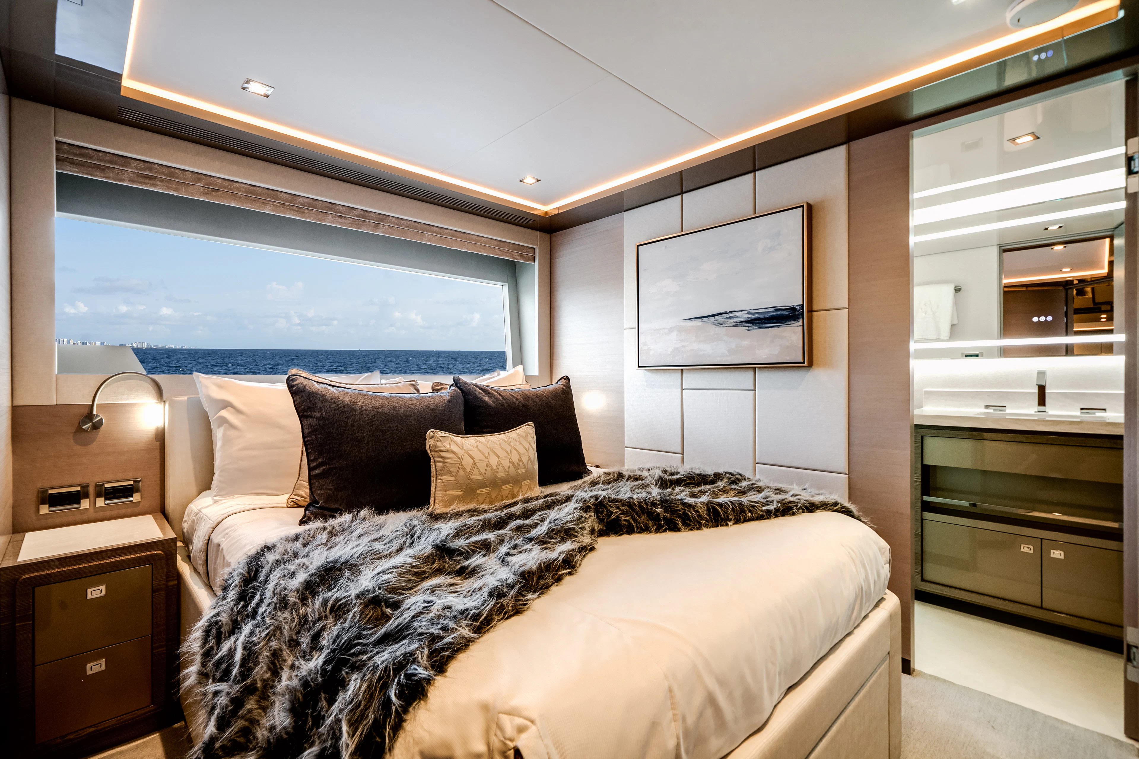 a bed with a large mirror above it aboard JUST A VACATION Yacht for Sale