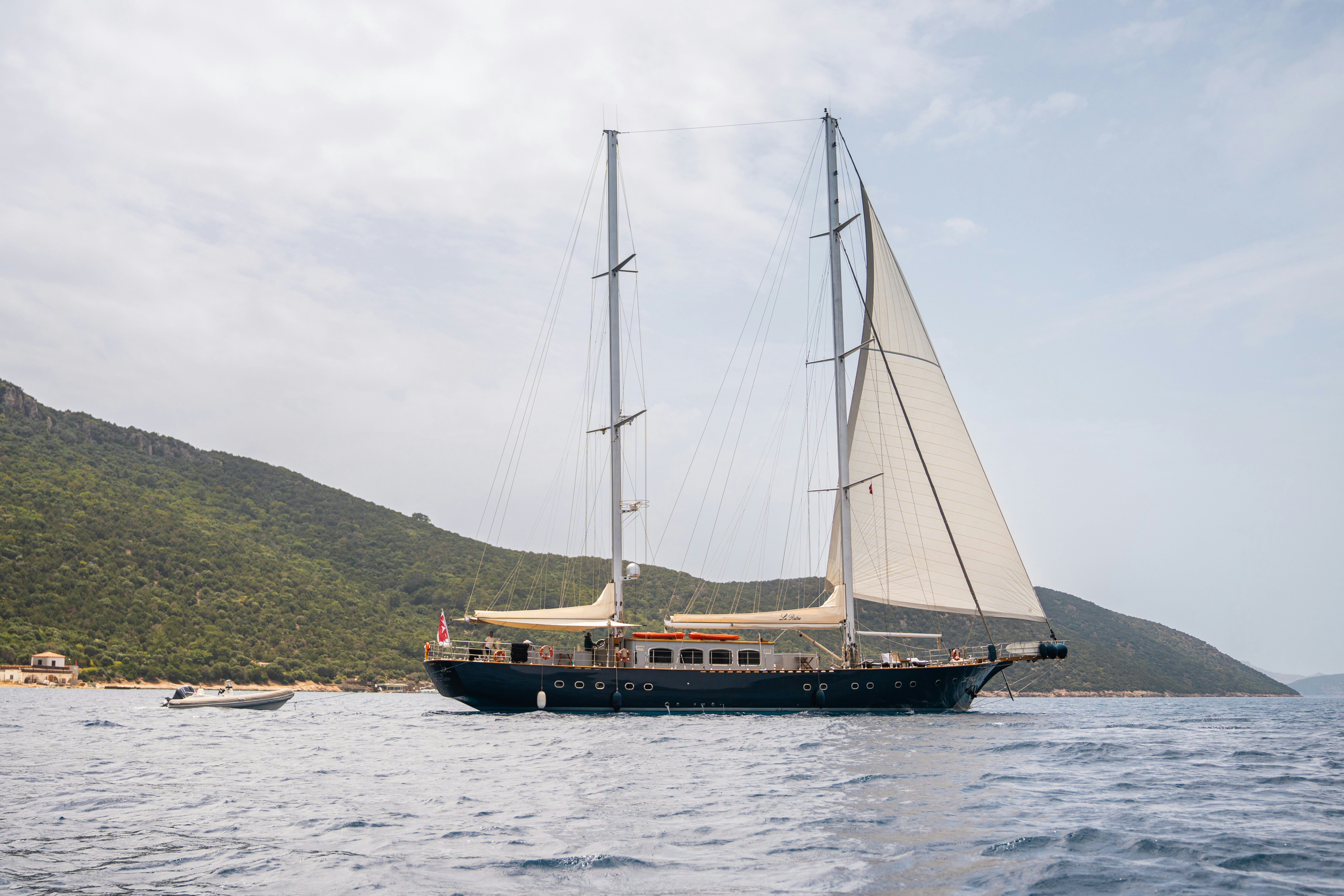 a boat sailing on the water aboard LE PIETRE Yacht for Sale