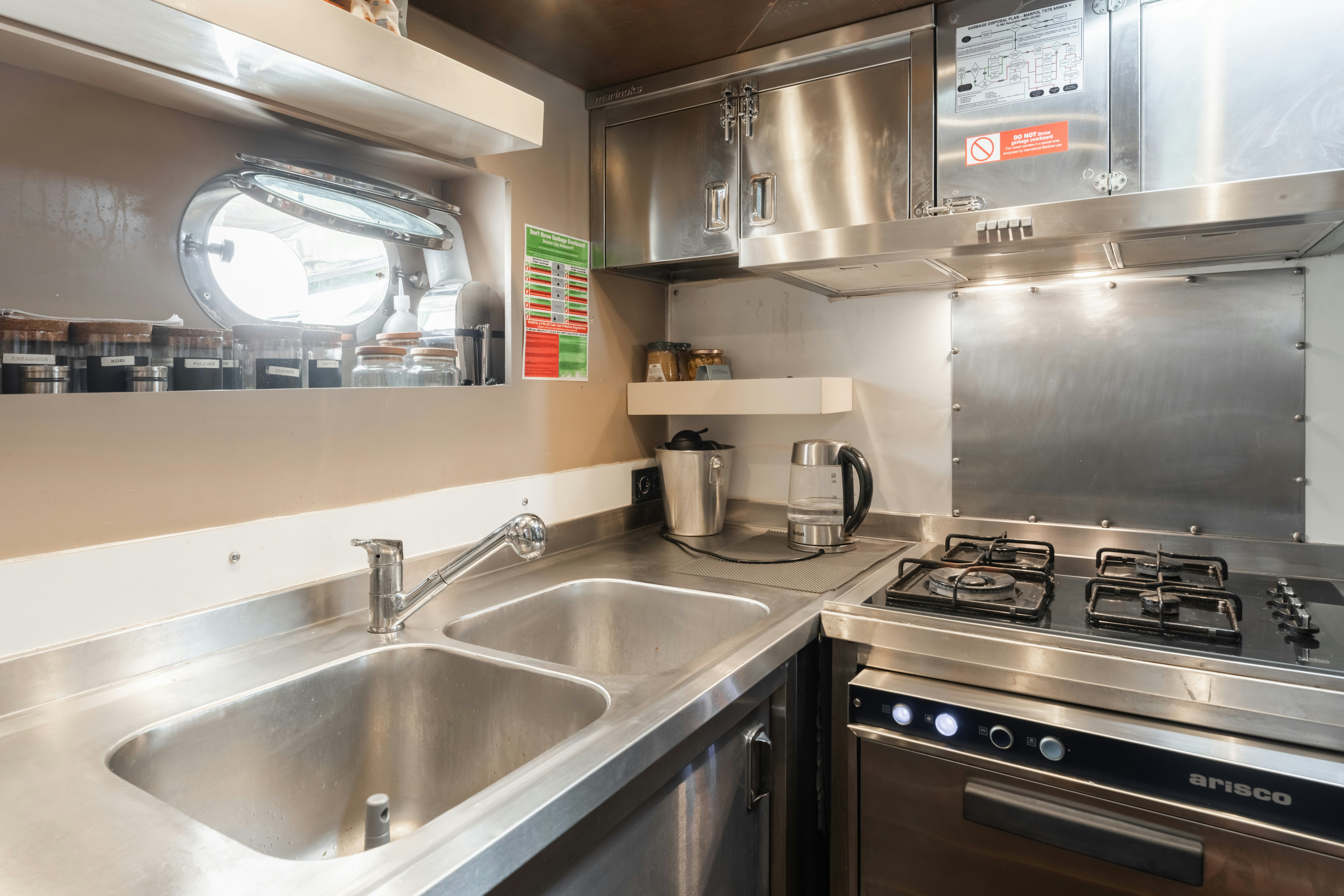 a kitchen with stainless steel appliances aboard LE PIETRE Yacht for Sale