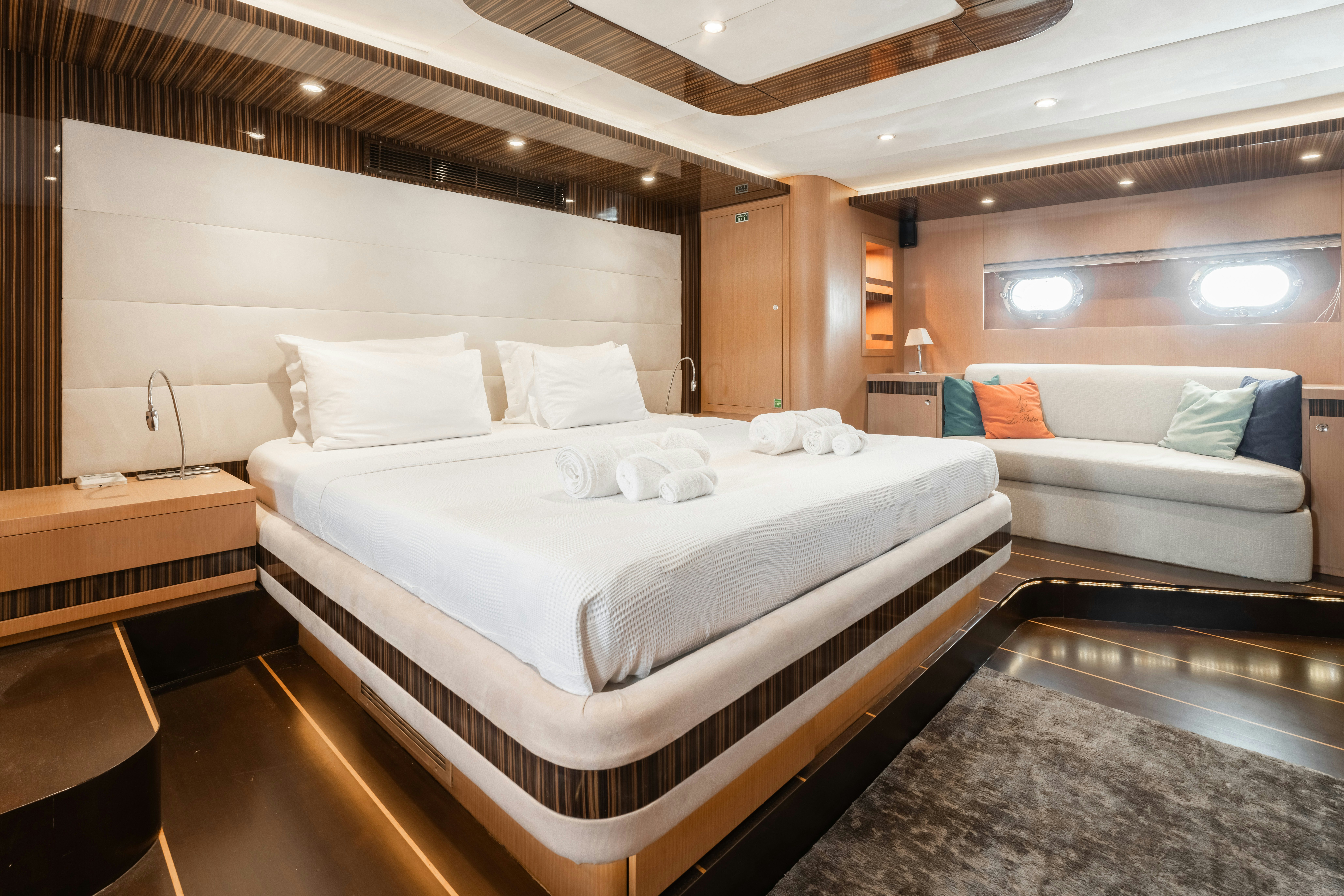 a large bed in a room aboard LE PIETRE Yacht for Sale