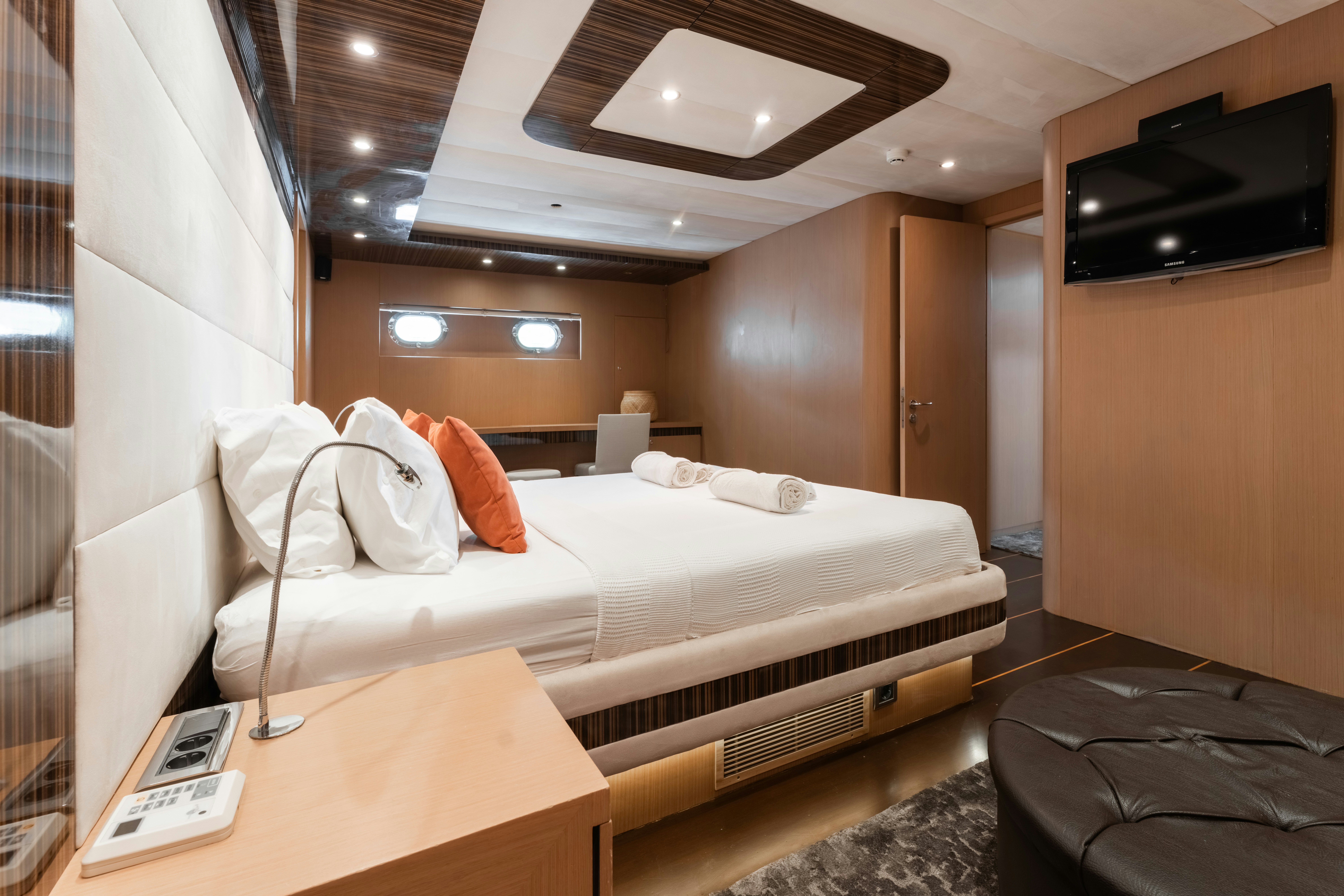 a room with a bed and a tv aboard LE PIETRE Yacht for Sale