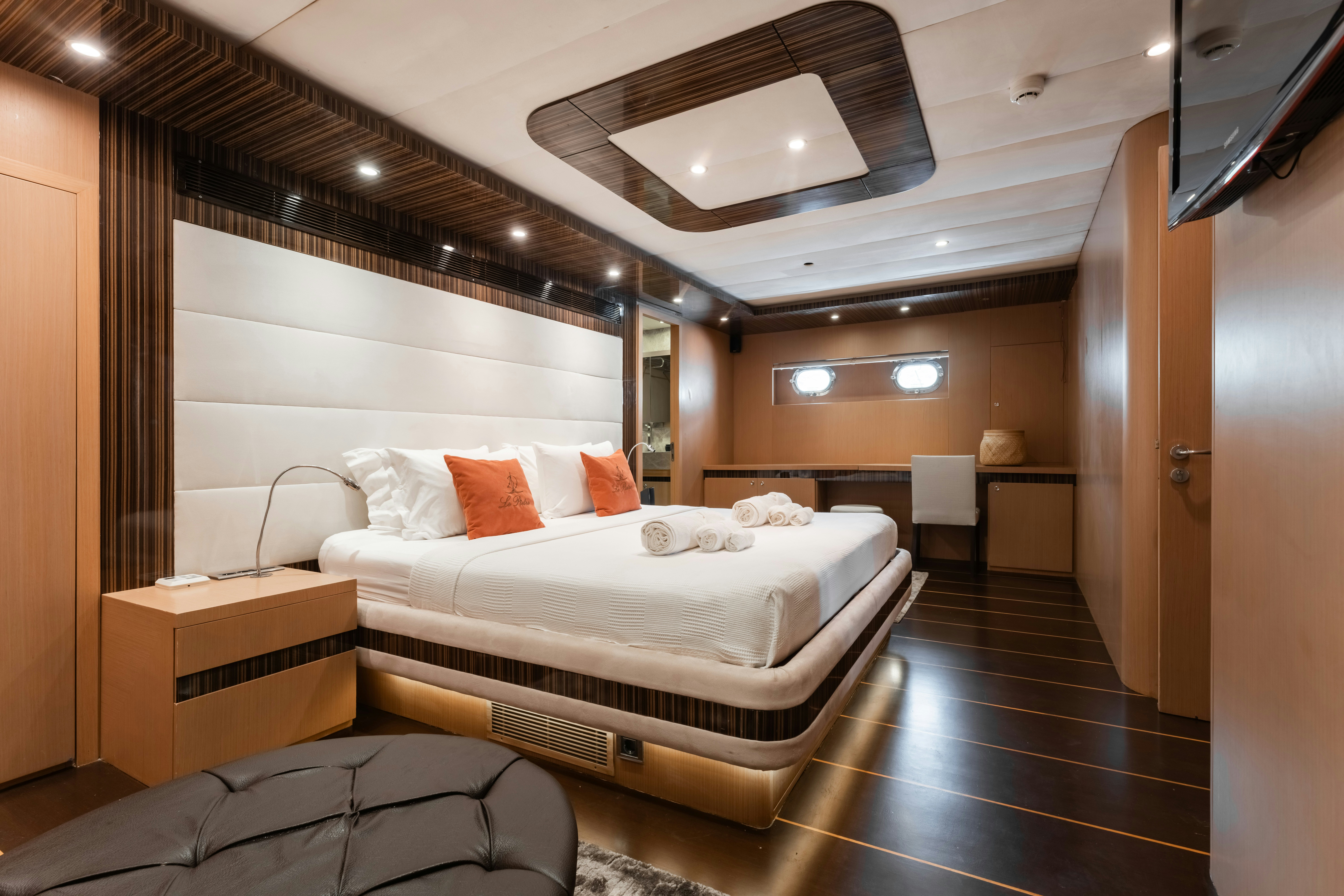 a room with a bed and a desk aboard LE PIETRE Yacht for Sale