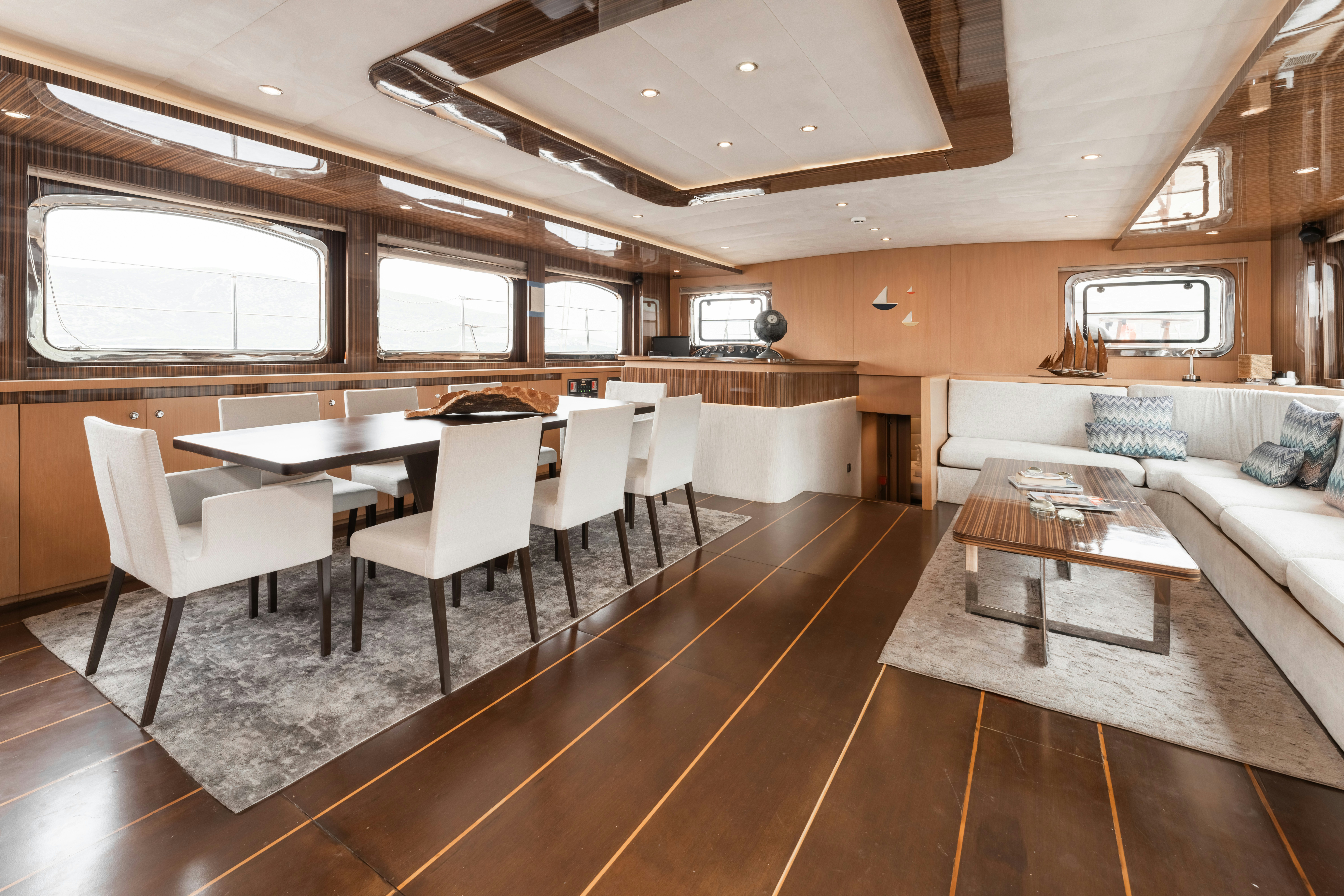 a large room with a couch and a table aboard LE PIETRE Yacht for Sale