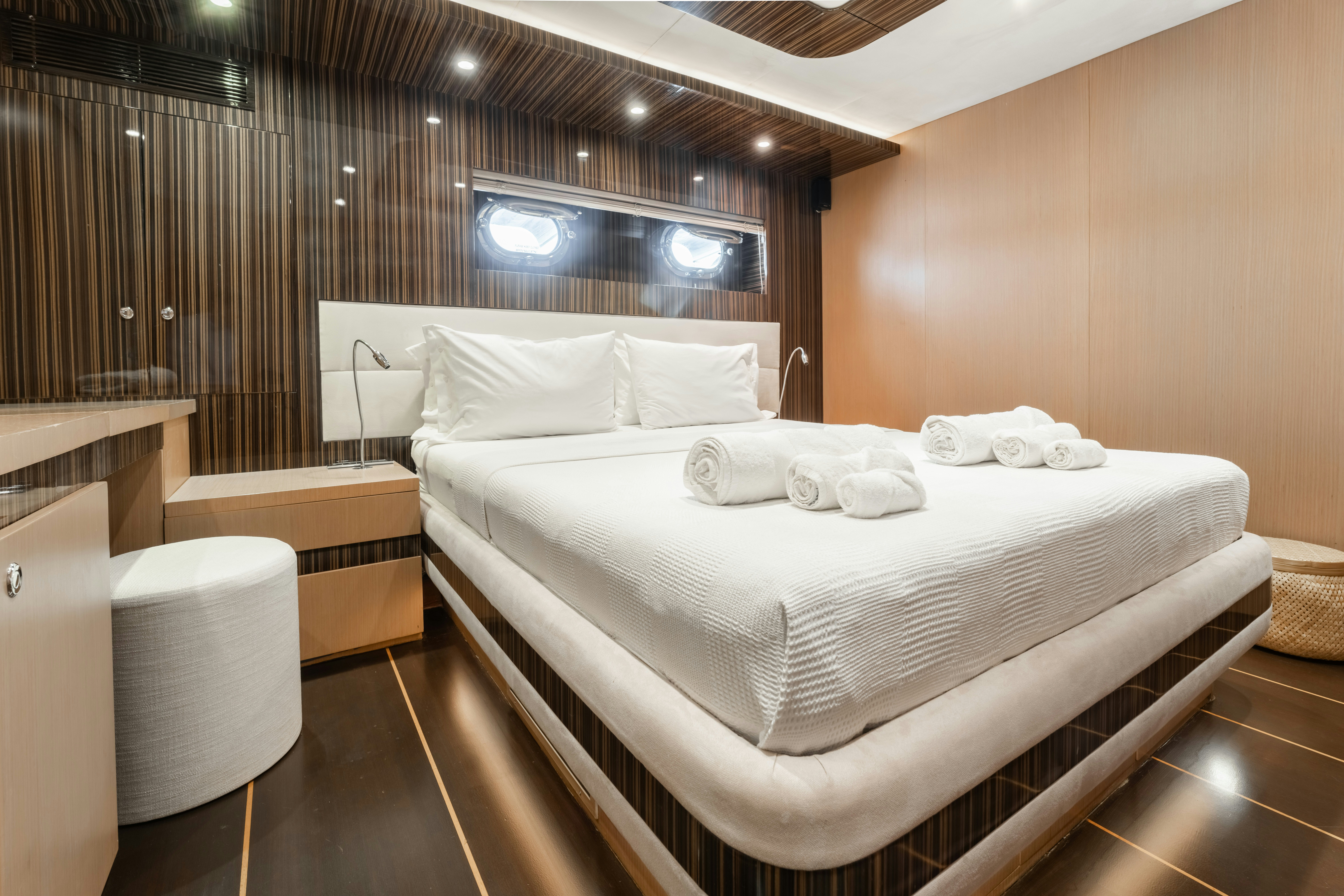 a room with a bed and a television aboard LE PIETRE Yacht for Sale