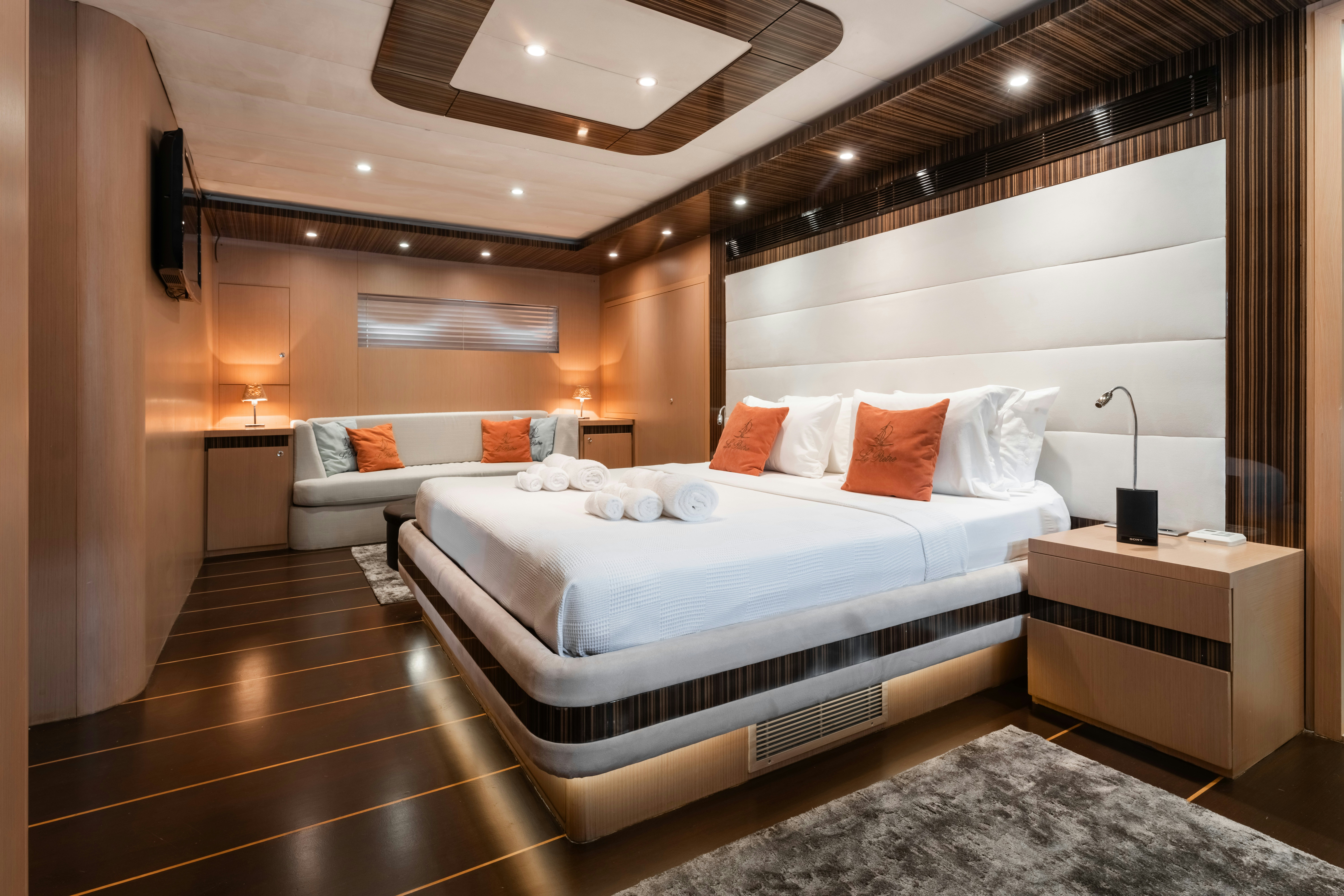 a room with a bed and a couch aboard LE PIETRE Yacht for Sale