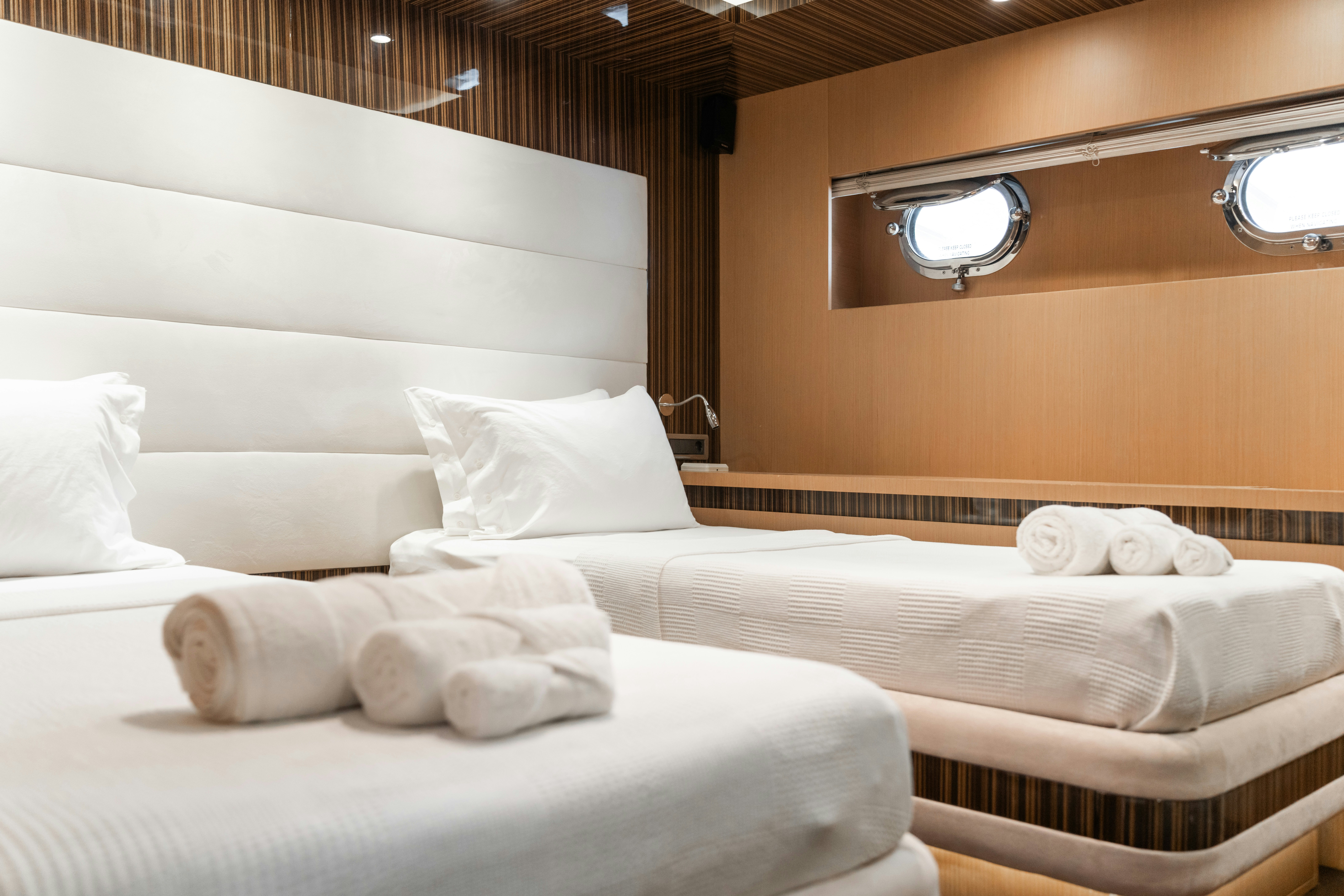 a room with a bed and a window aboard LE PIETRE Yacht for Sale