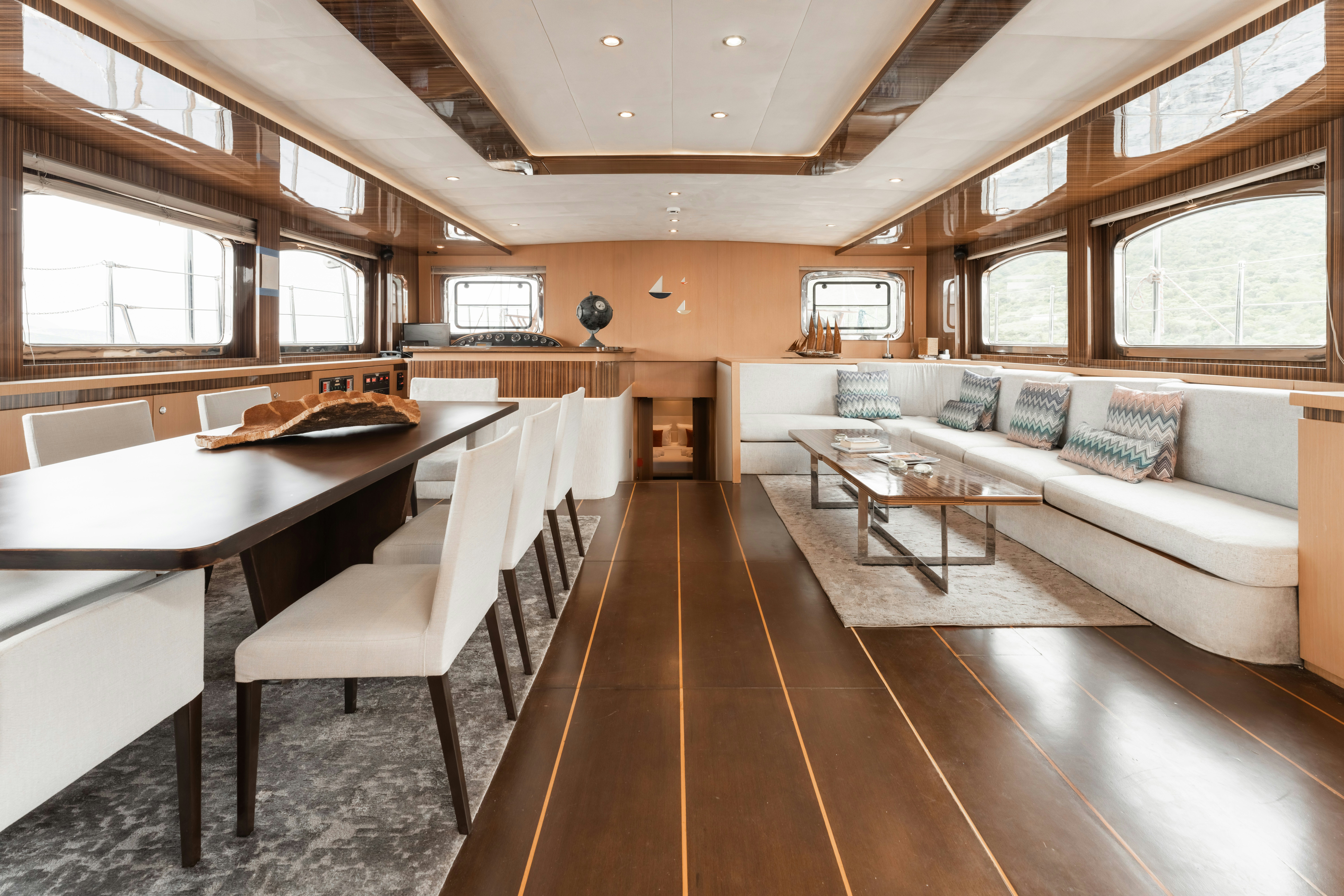 a large room with a couch and a table aboard LE PIETRE Yacht for Sale
