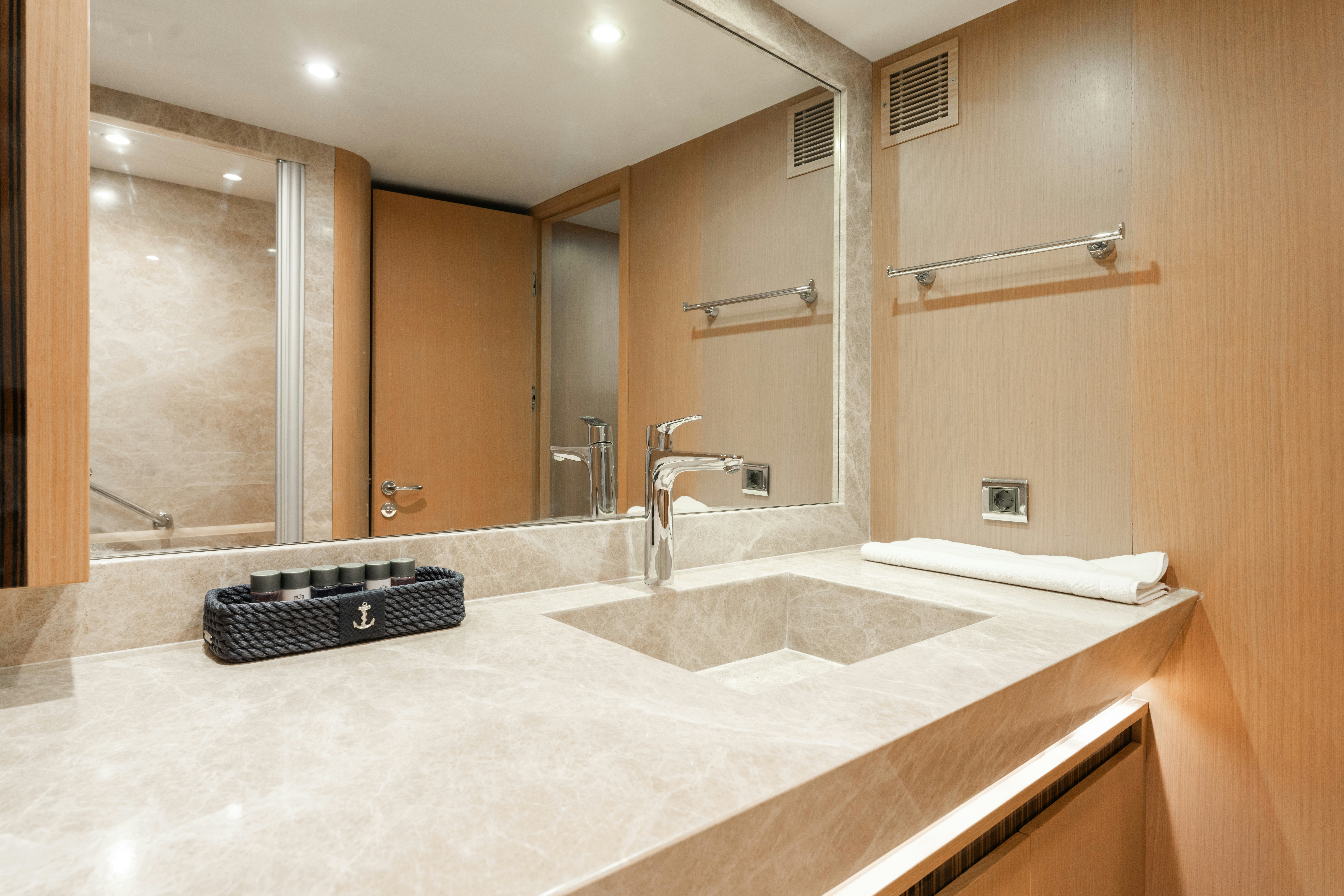 a bathroom with a large mirror aboard LE PIETRE Yacht for Sale