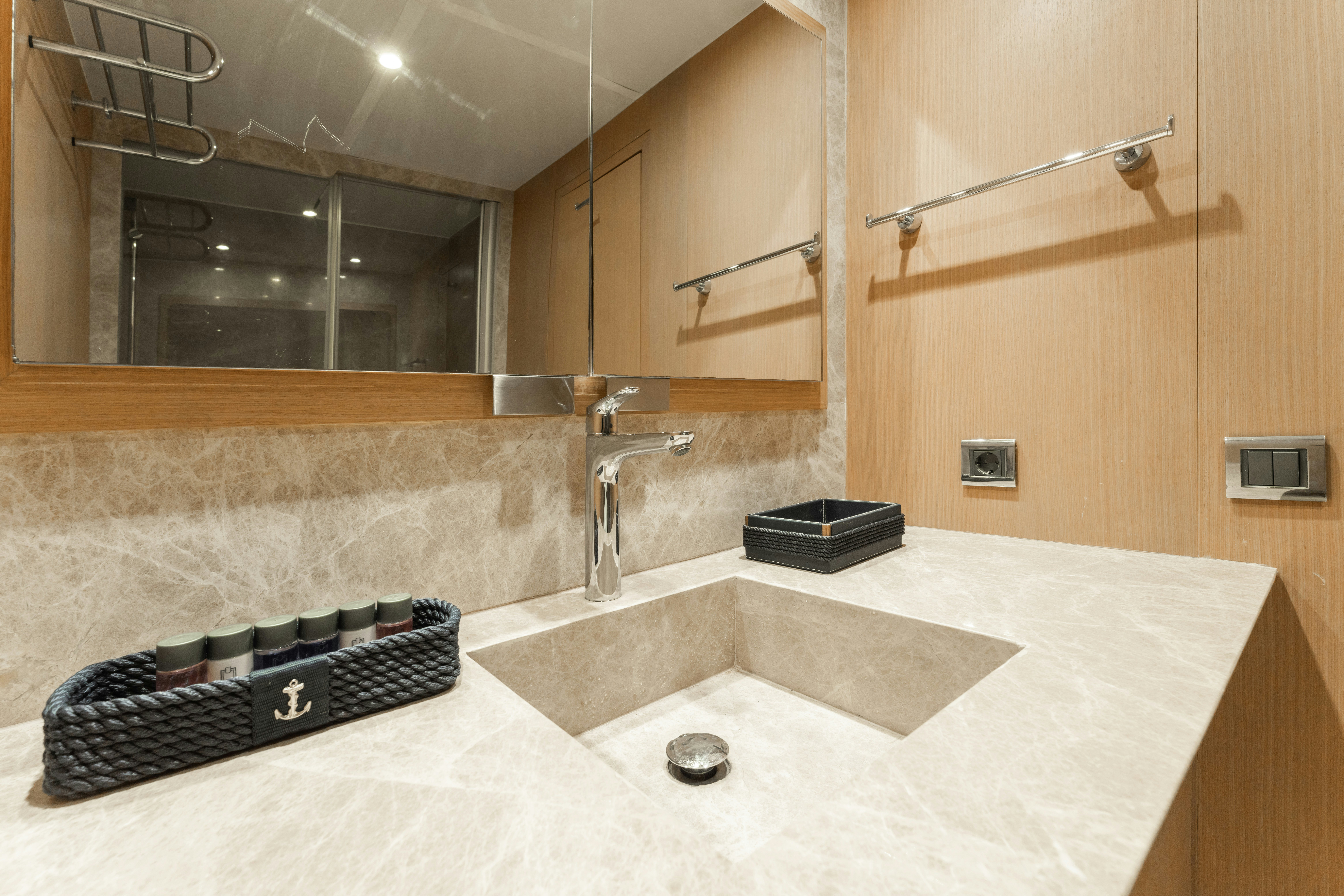 a bathroom with a large mirror aboard LE PIETRE Yacht for Sale