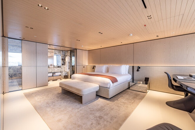 a room with couches and a table aboard VIRTUOSITY Yacht for Charter
