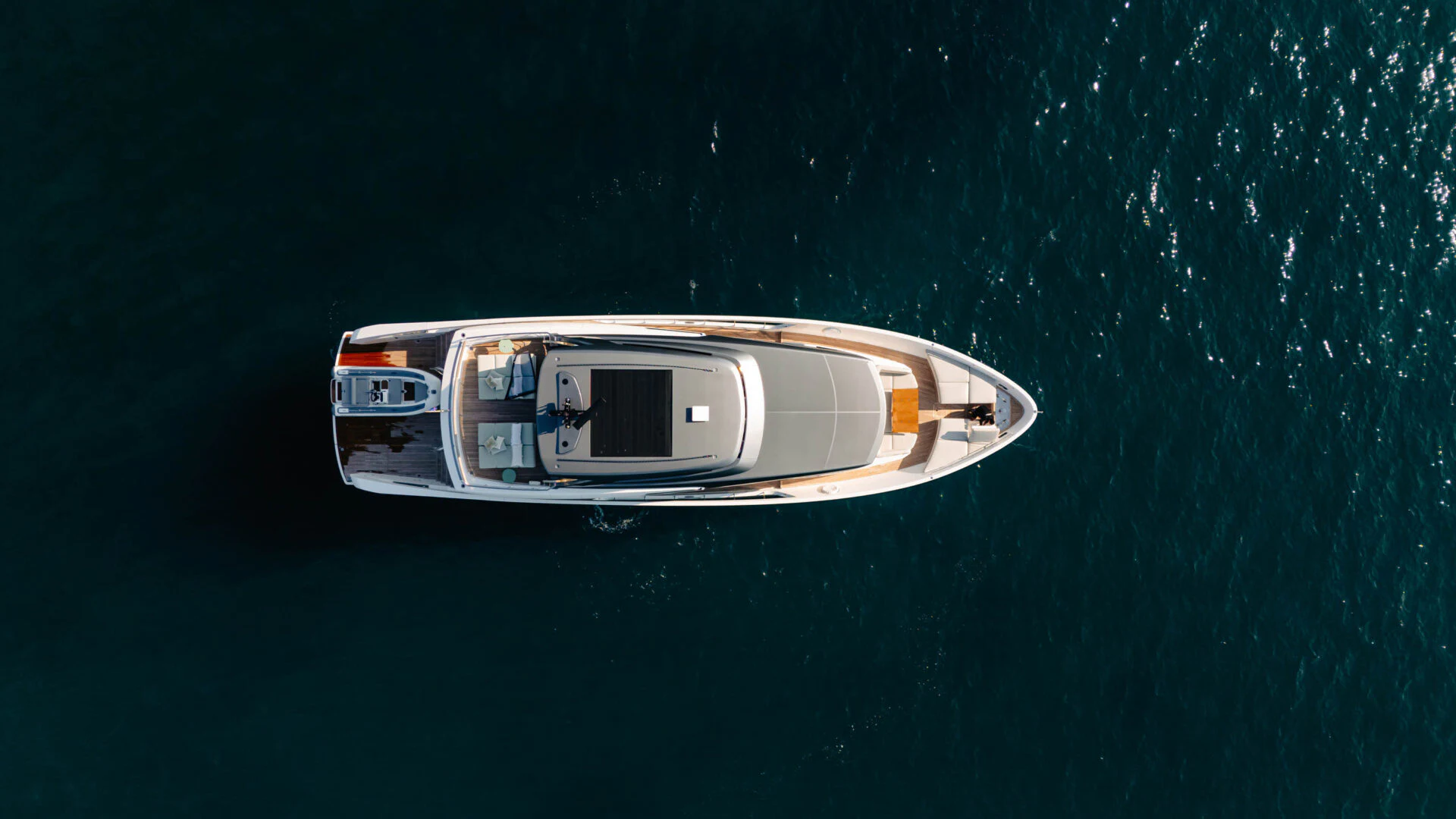 a white car on a green surface aboard BLUE ZONE Yacht for Sale
