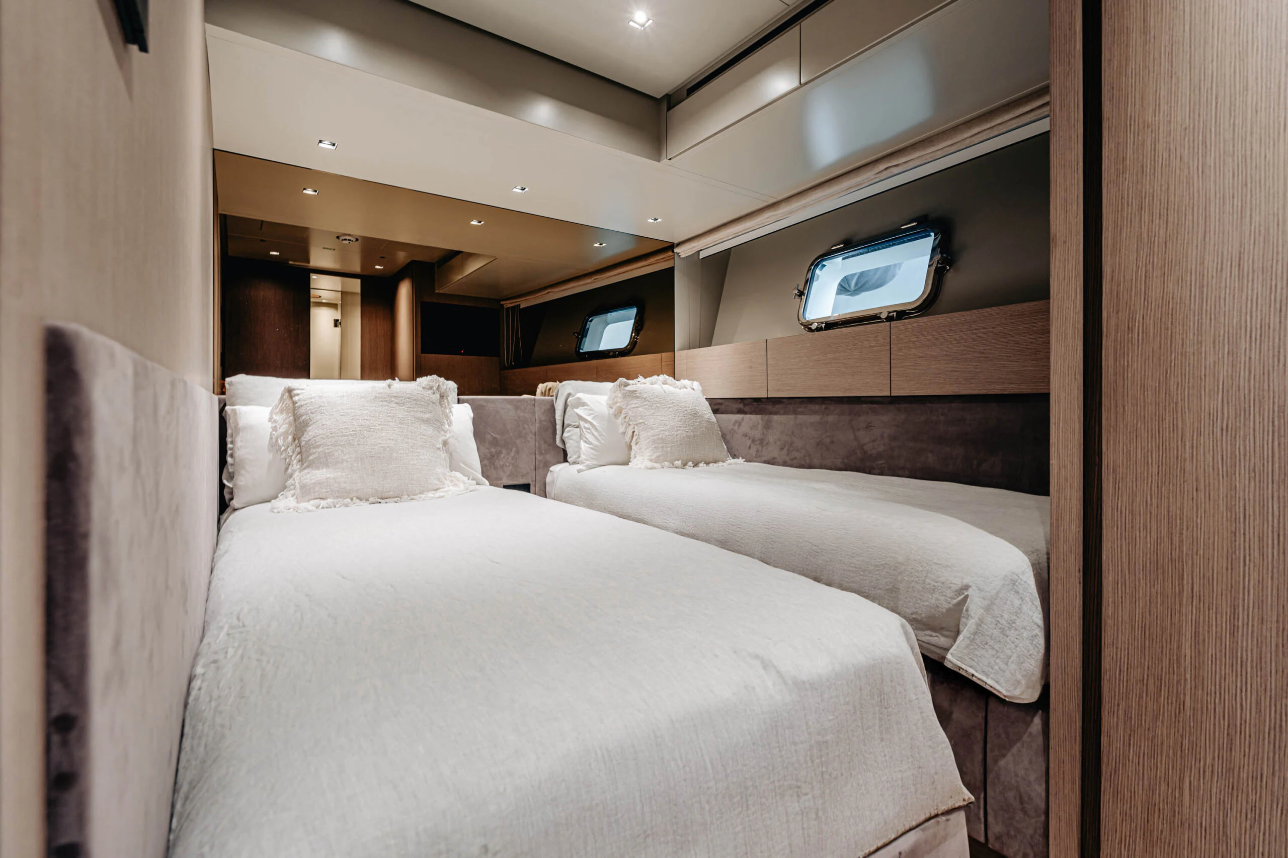a bed with a television on the wall aboard BLUE ZONE Yacht for Sale