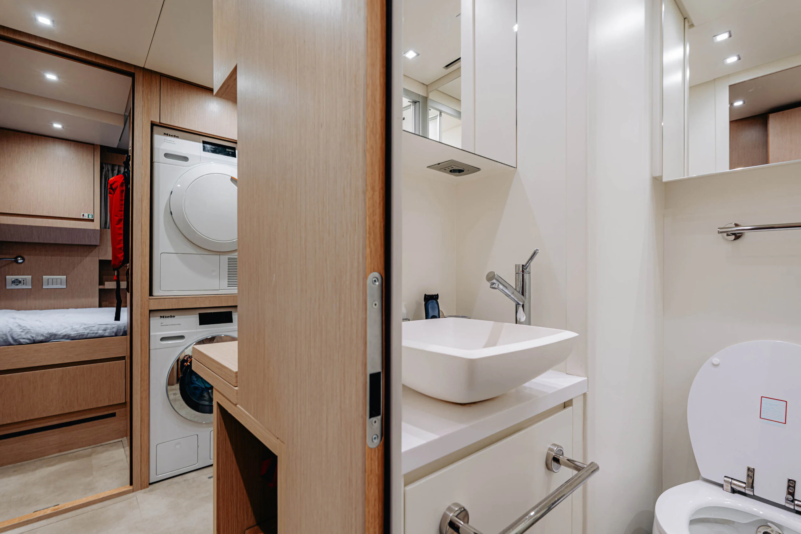 a bathroom with a sink and a toilet aboard BLUE ZONE Yacht for Sale