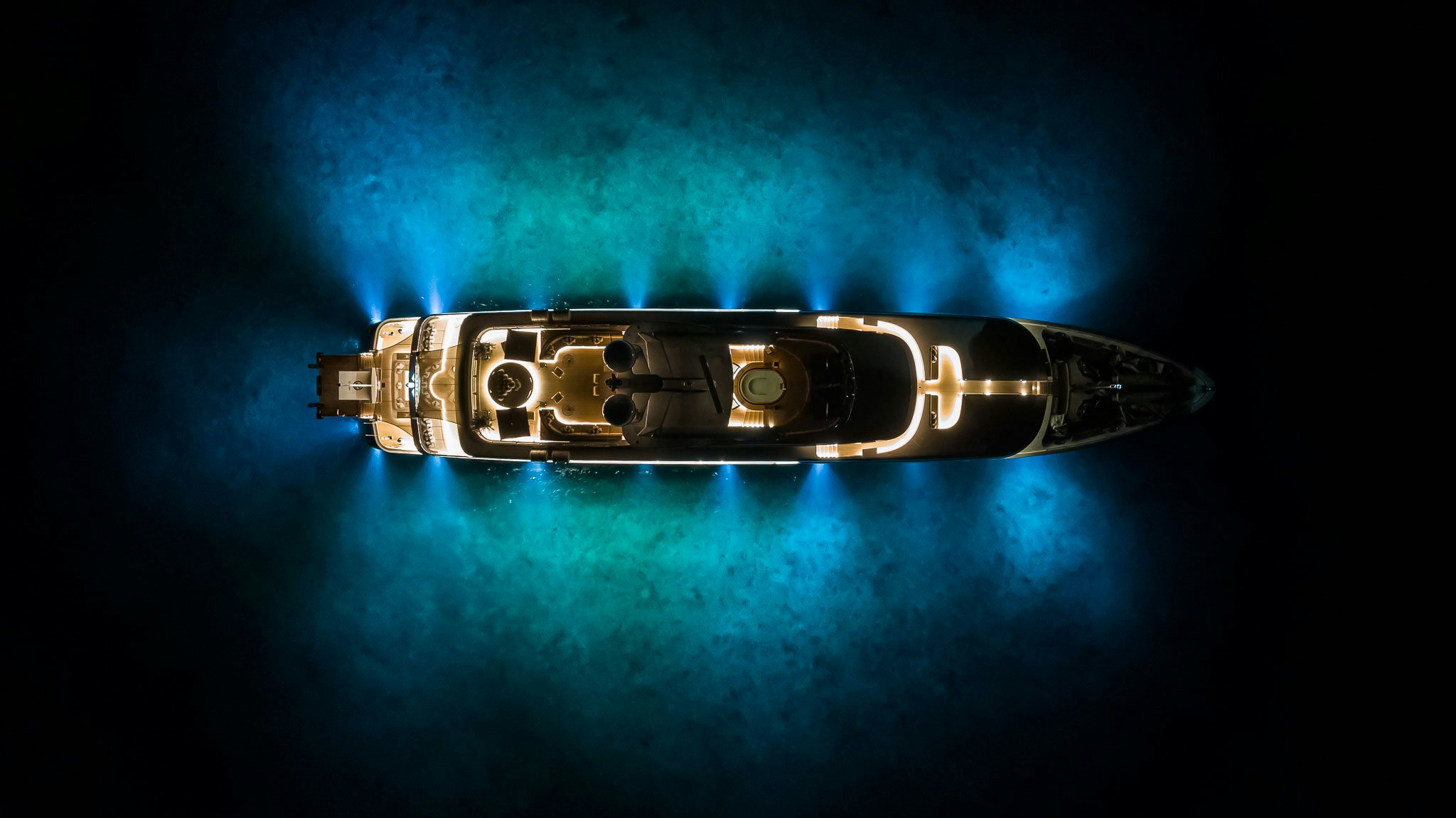a gold metal object with a black background aboard SEALION Yacht for Charter