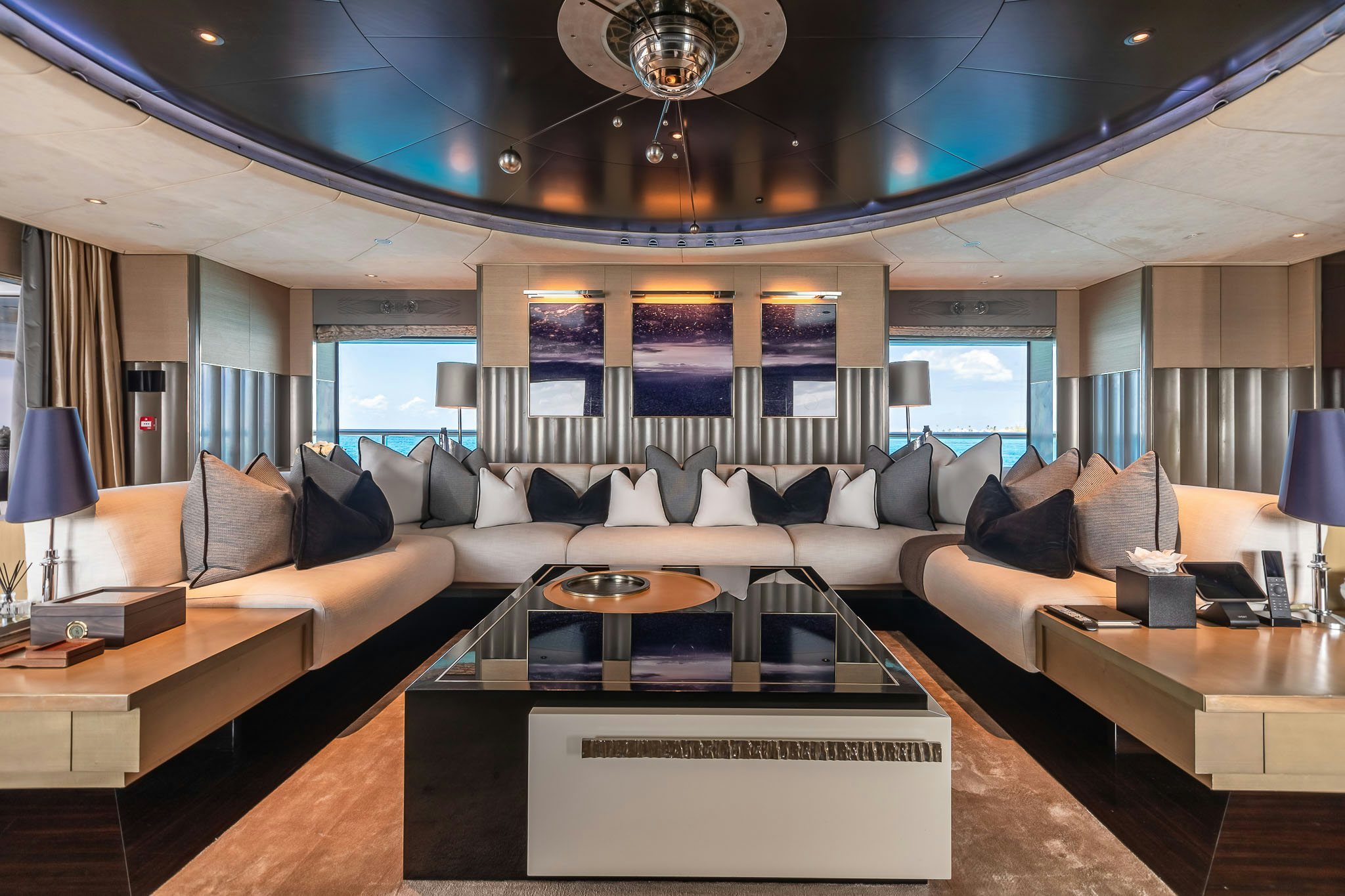 a living room with a large window aboard SEALION Yacht for Charter