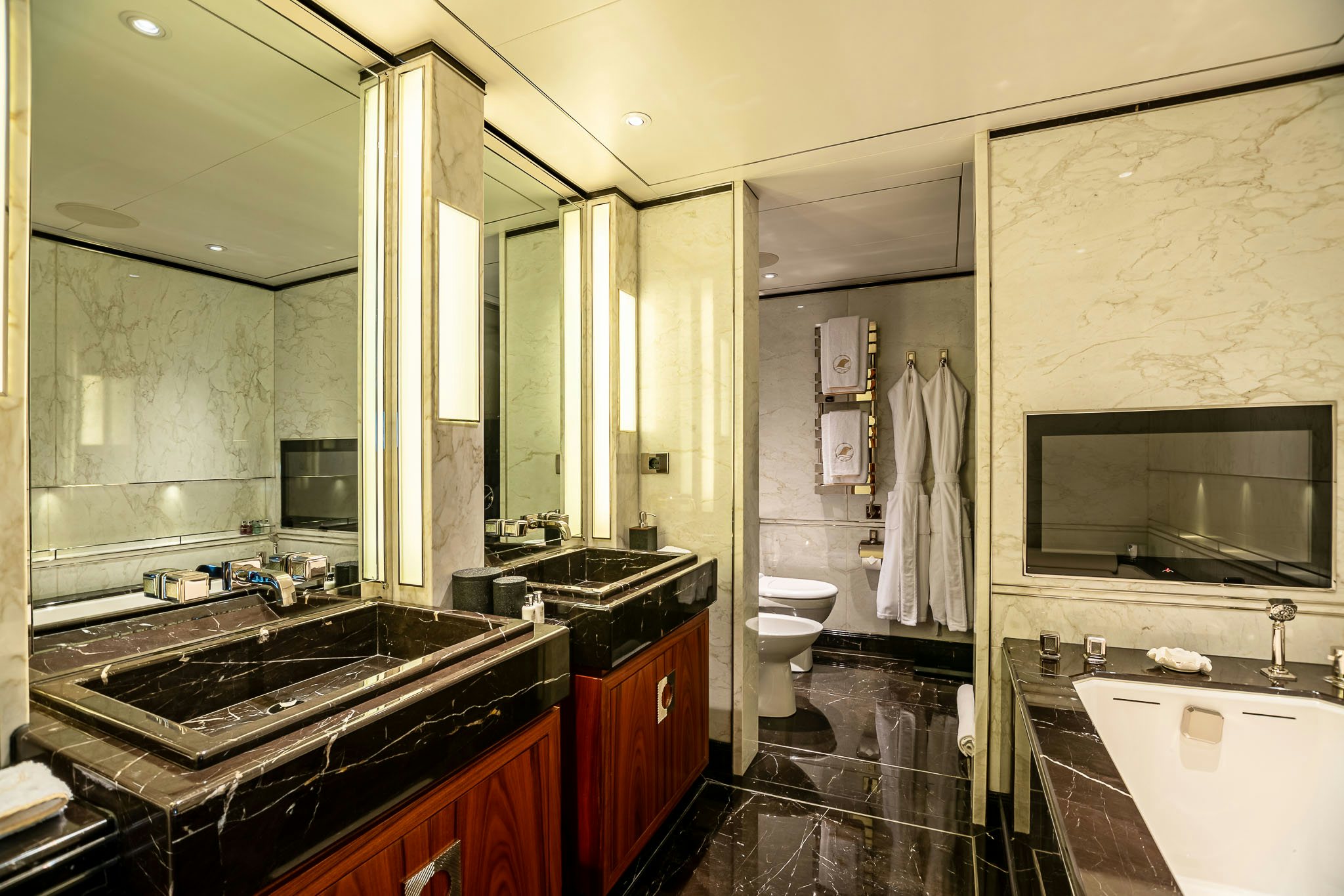 a bathroom with a large mirror aboard SEALION Yacht for Charter