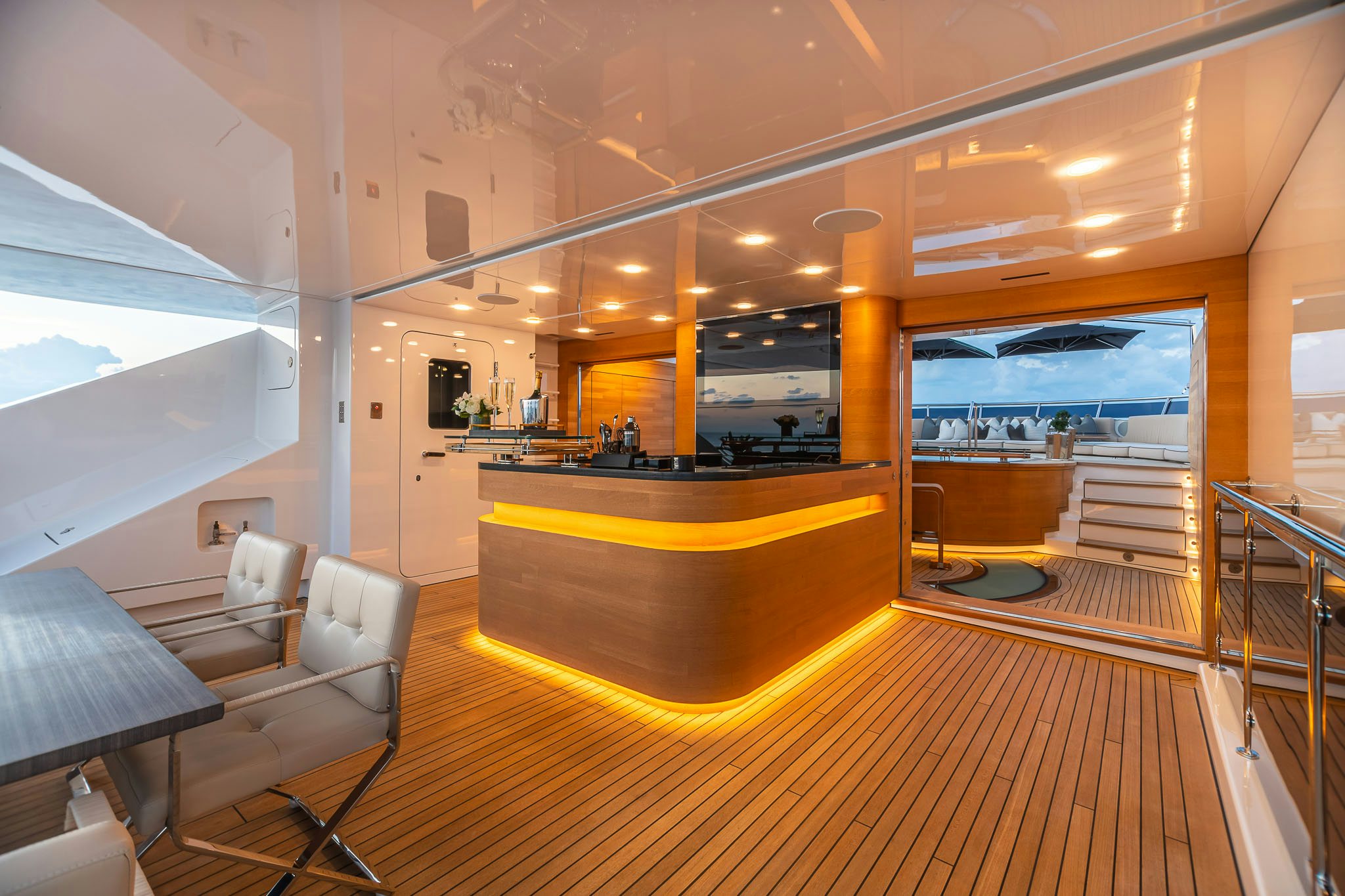 a room with a table and chairs aboard SEALION Yacht for Charter