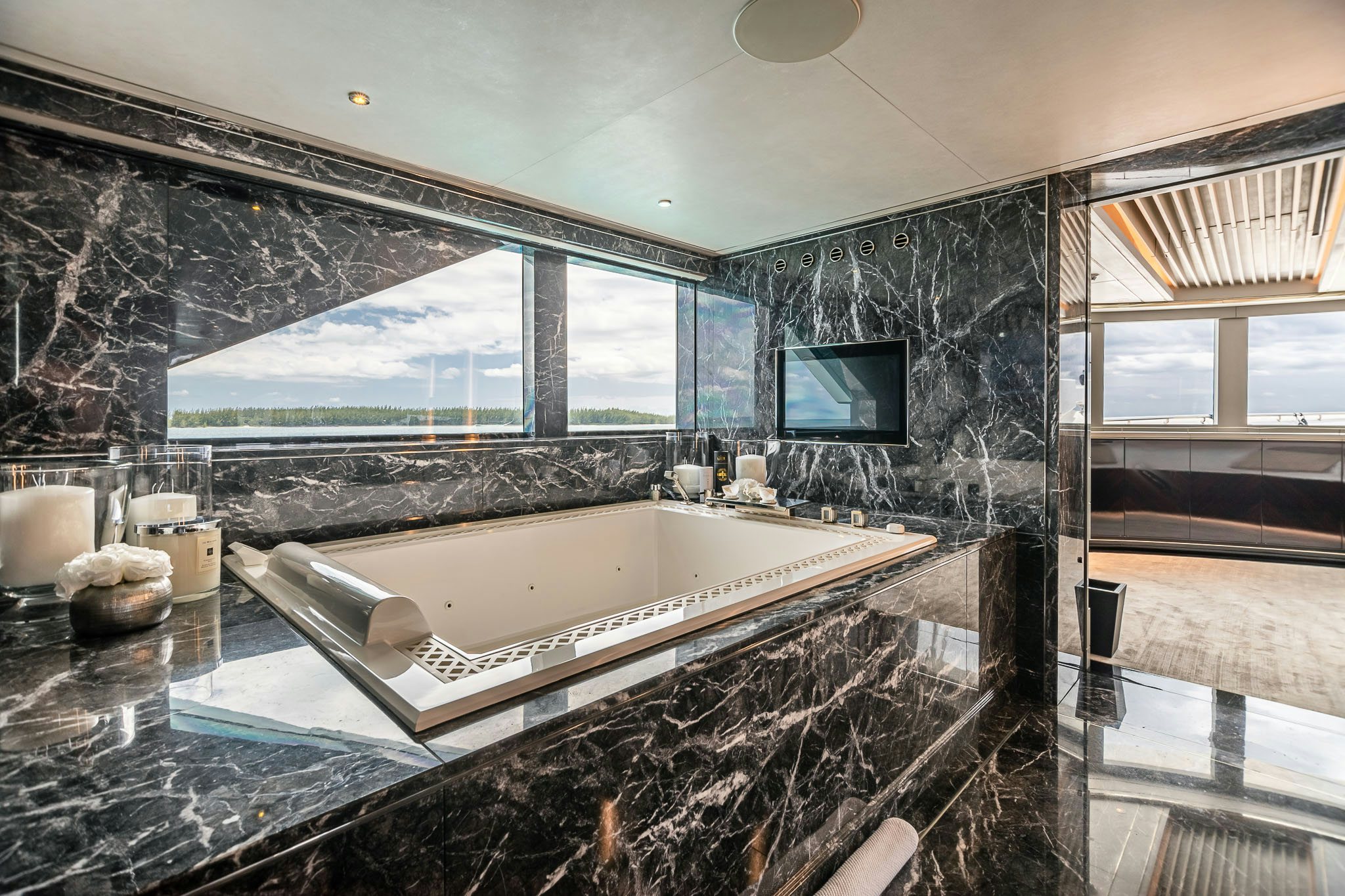 a large bathroom with a large jacuzzi tub aboard SEALION Yacht for Charter
