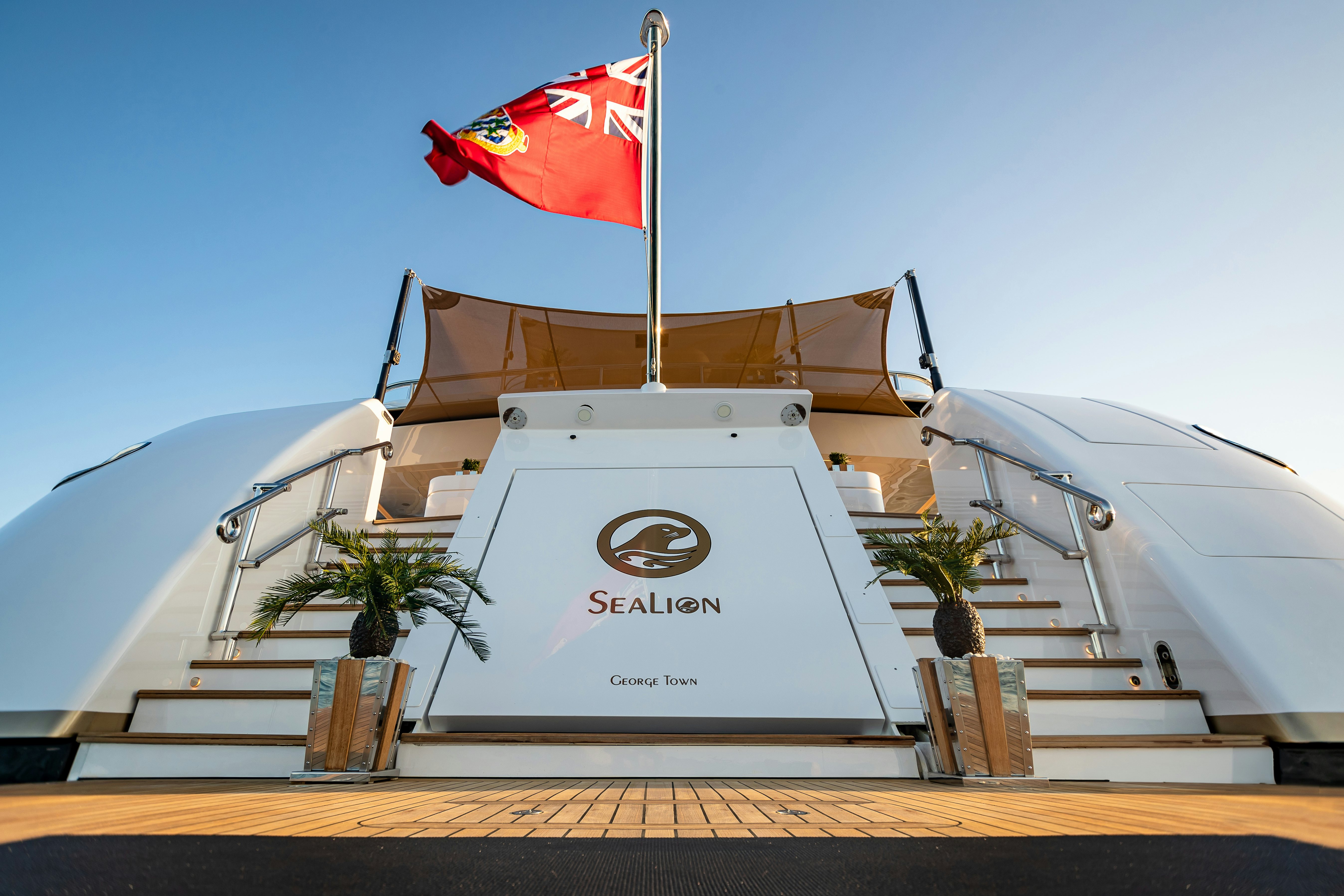 a building with a flag on top aboard SEALION Yacht for Charter