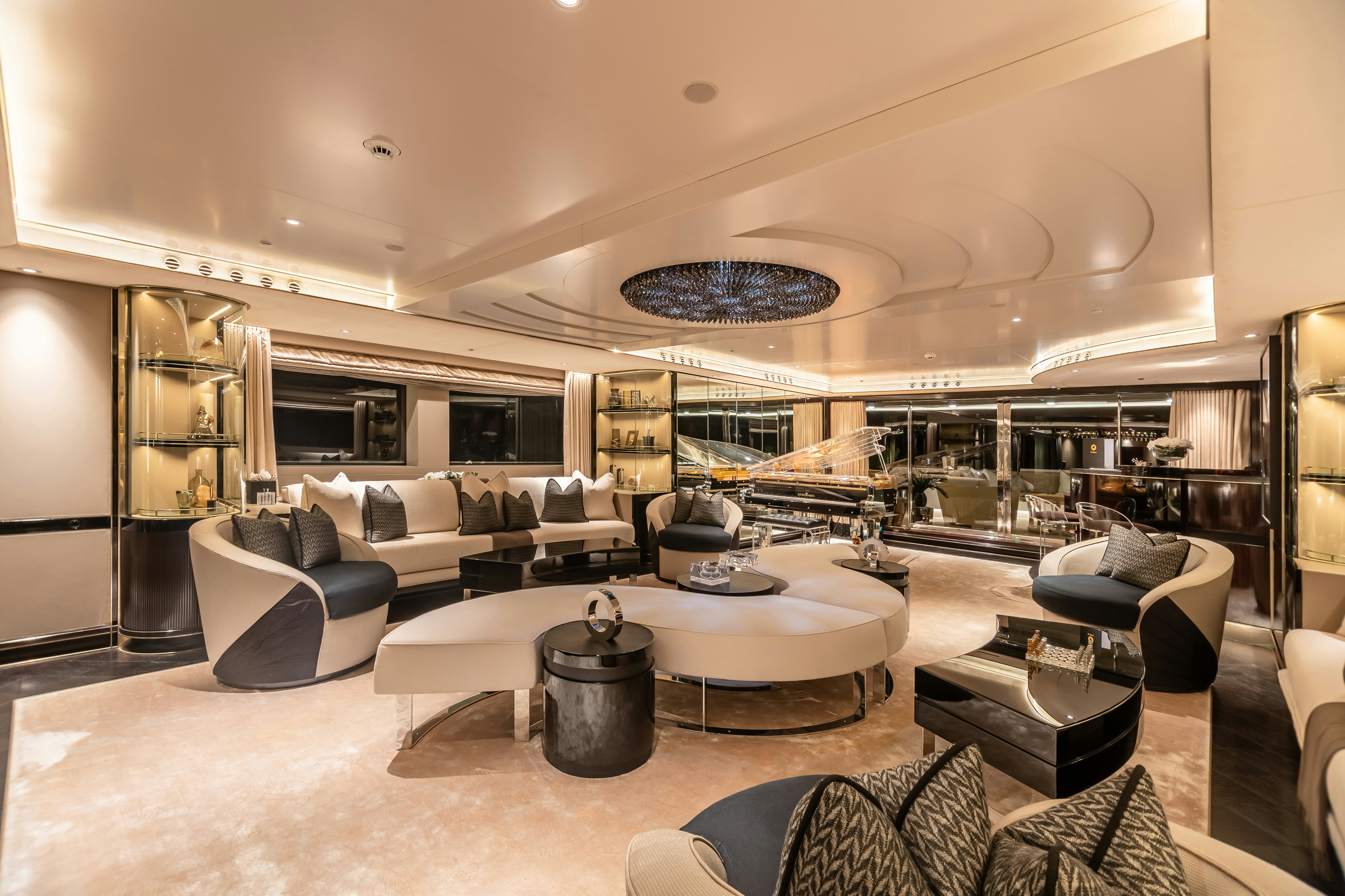 a living room with a large glass window aboard SEALION Yacht for Charter