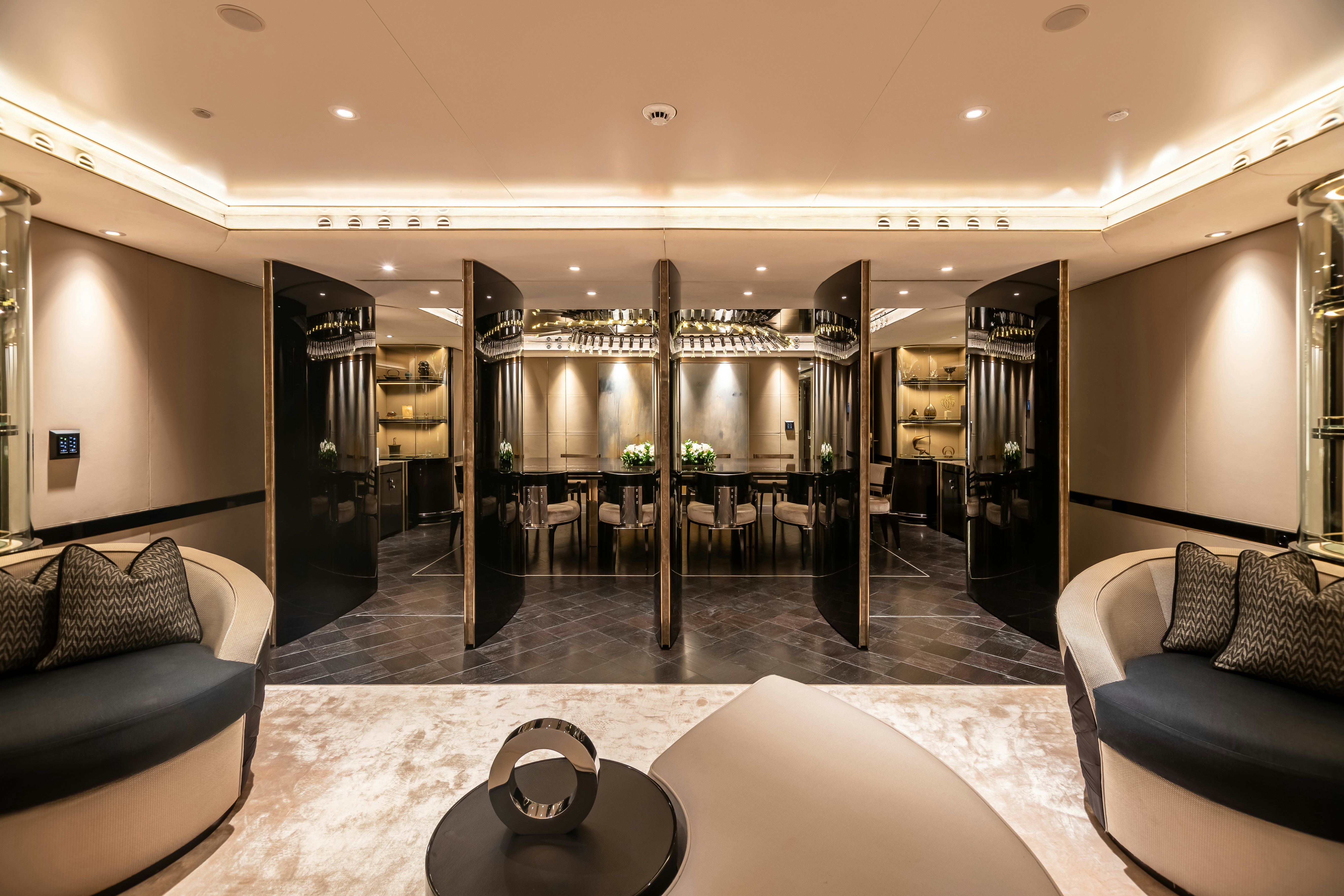 a large room with a glass door aboard SEALION Yacht for Charter