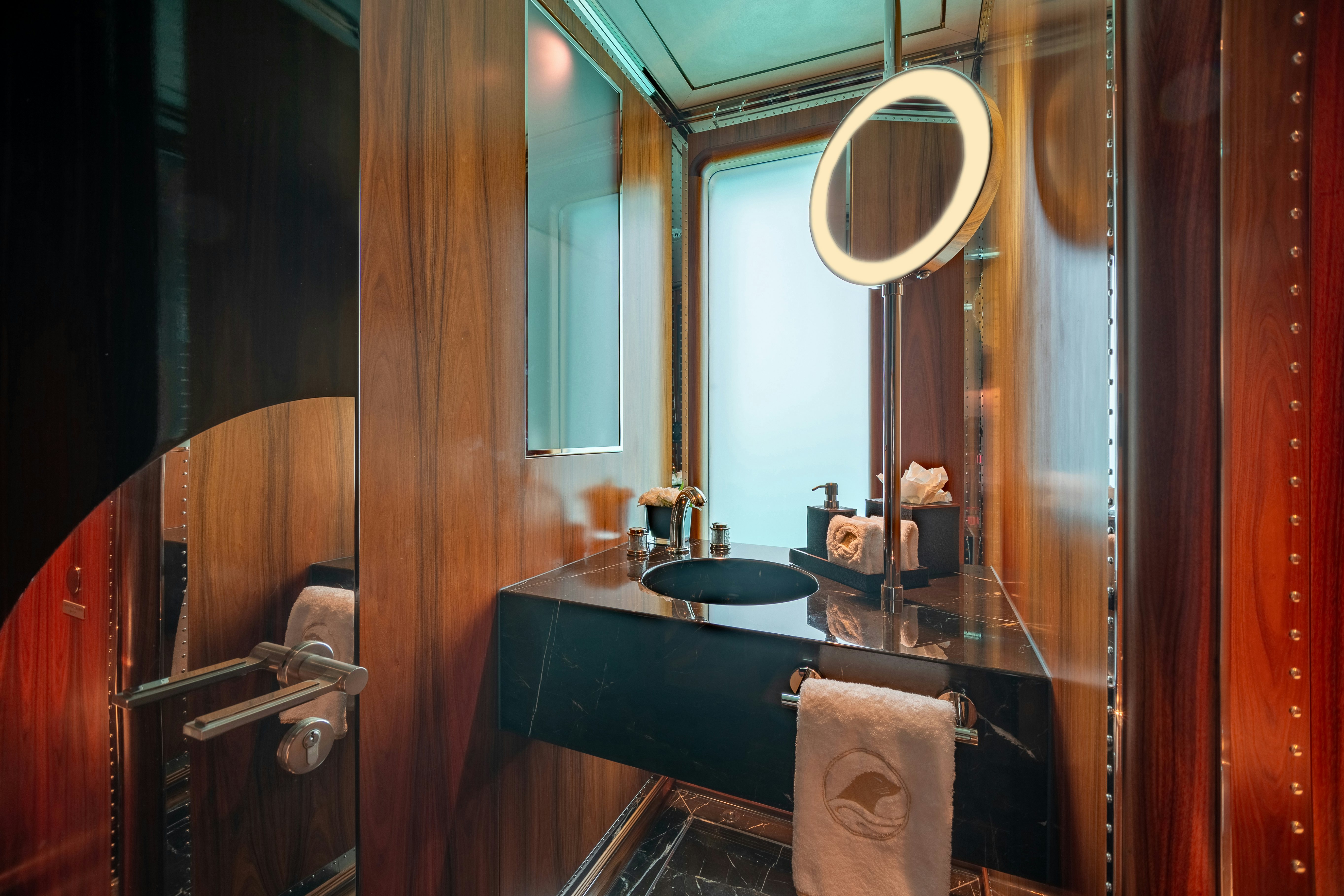 a bathroom with a sink and mirror aboard SEALION Yacht for Charter
