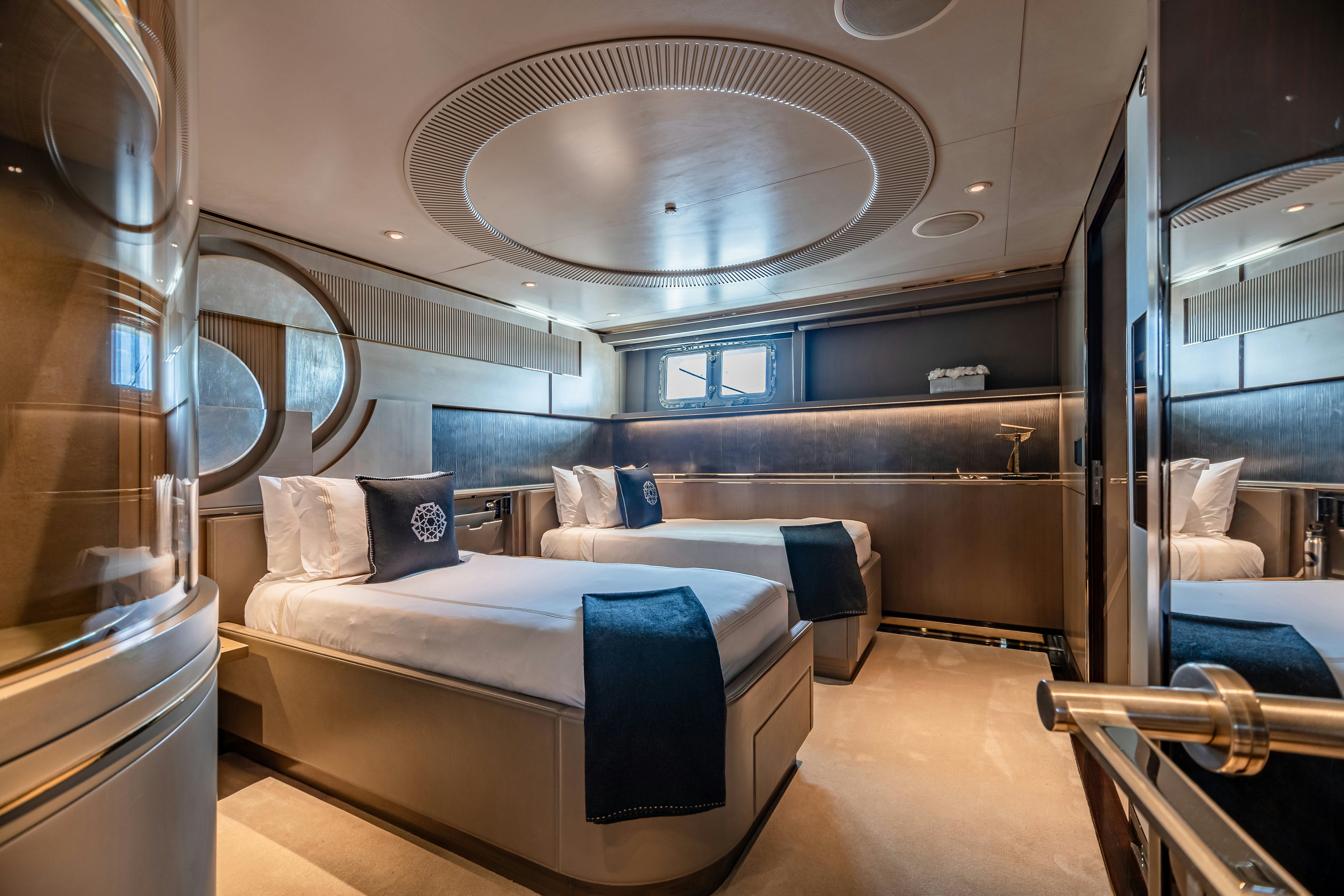 a room with a bed and a mirror aboard SEALION Yacht for Charter