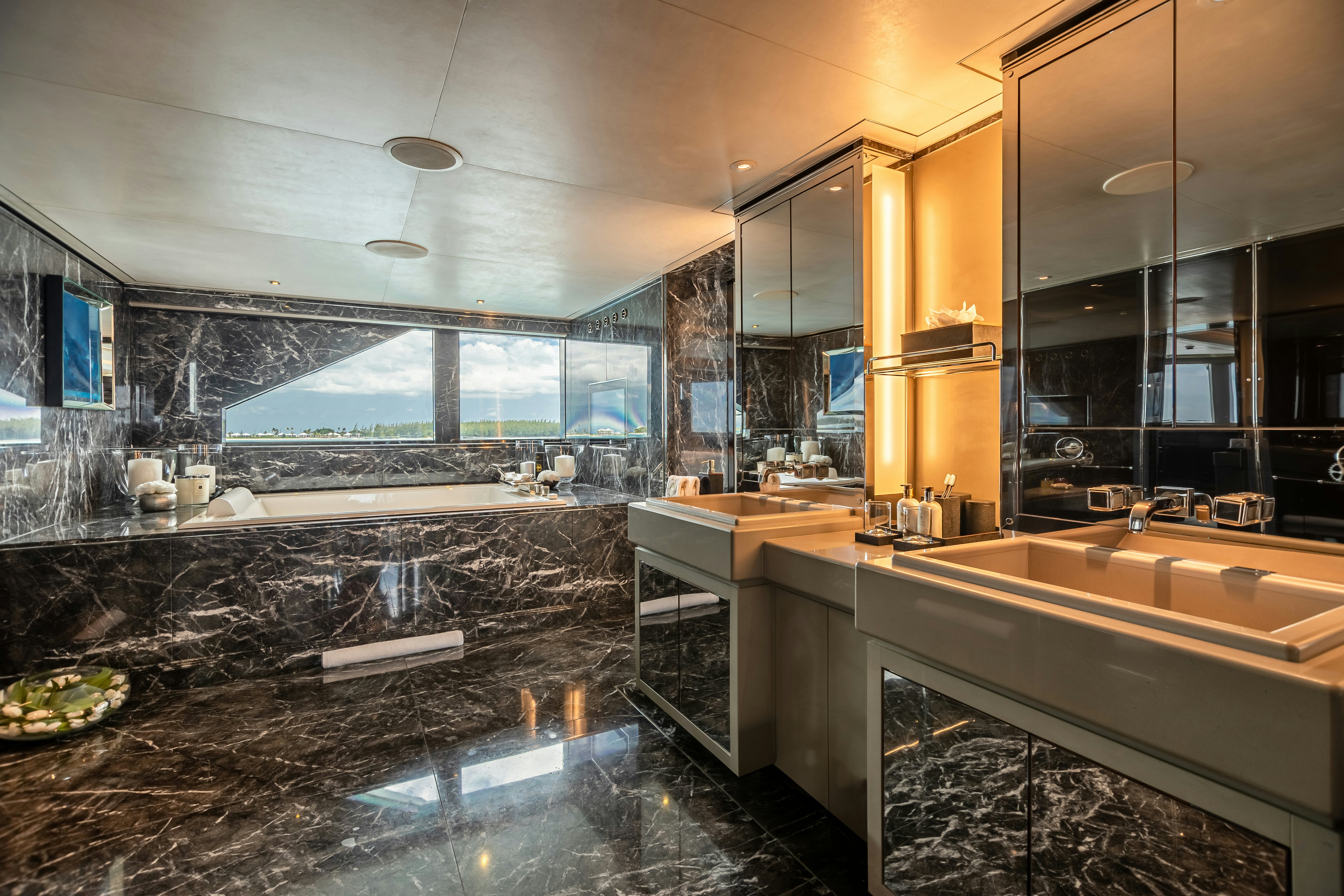 a large bathroom with a large glass shower aboard SEALION Yacht for Charter