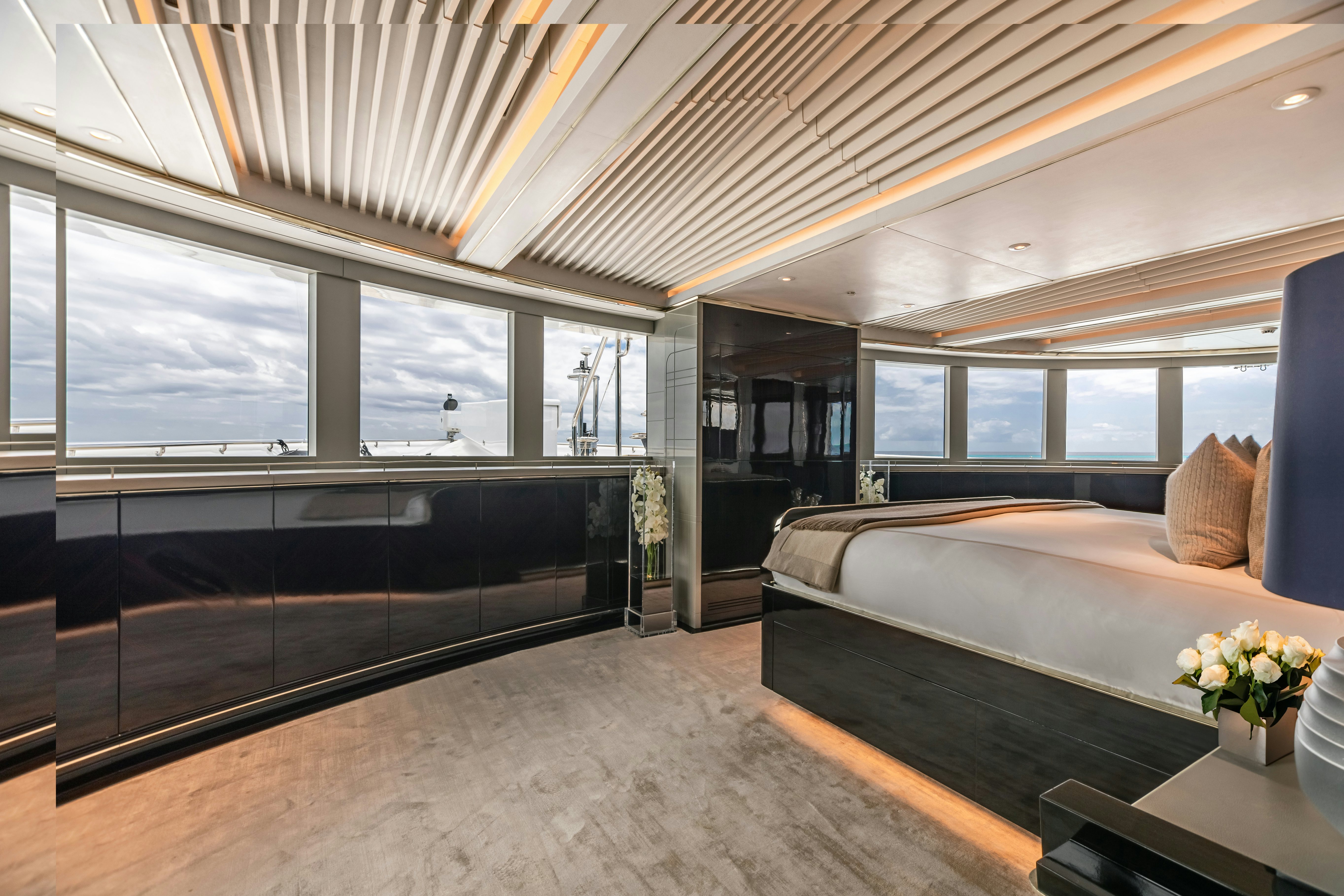 a large bedroom with a large bed aboard SEALION Yacht for Charter
