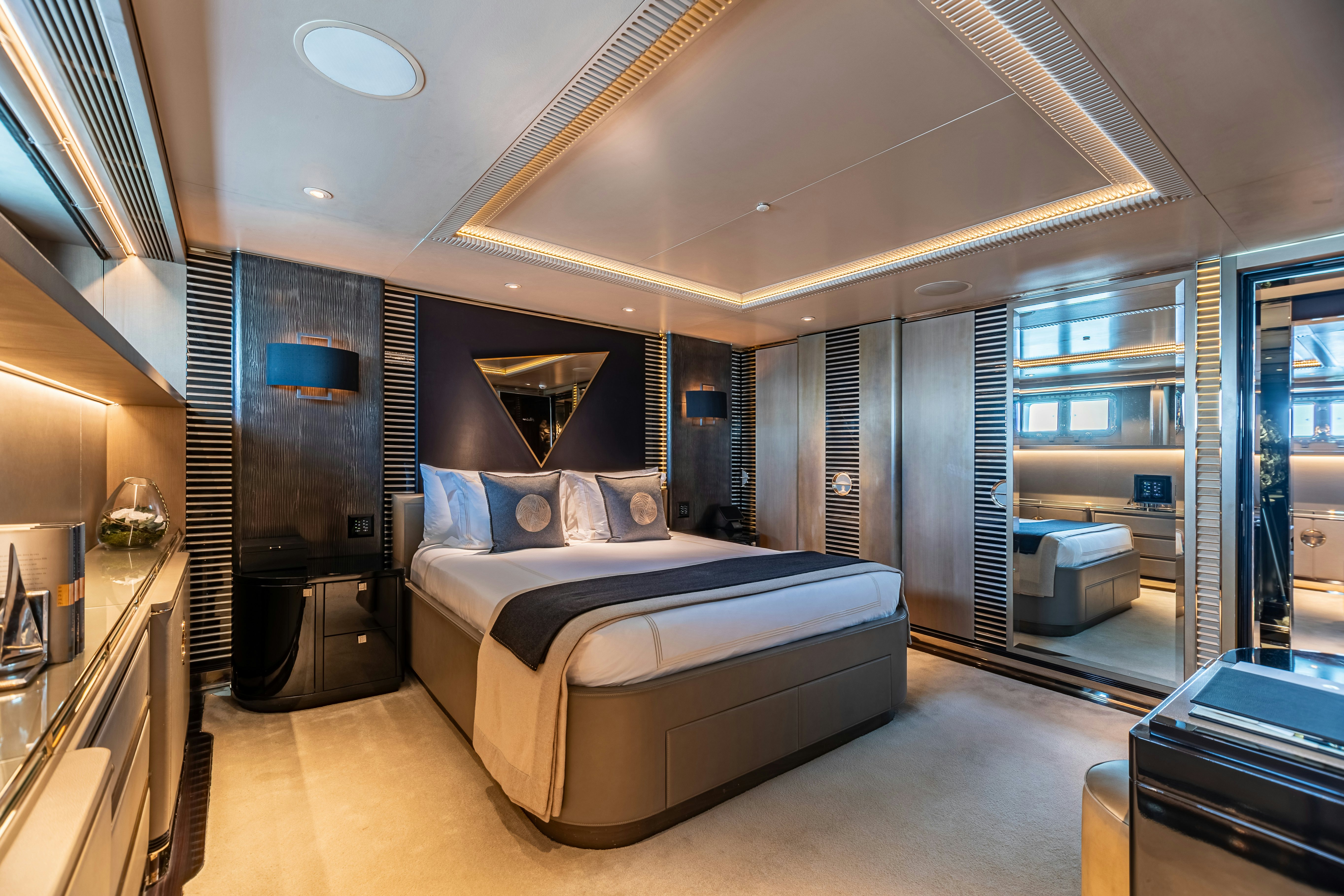 a bedroom with a bed aboard SEALION Yacht for Charter