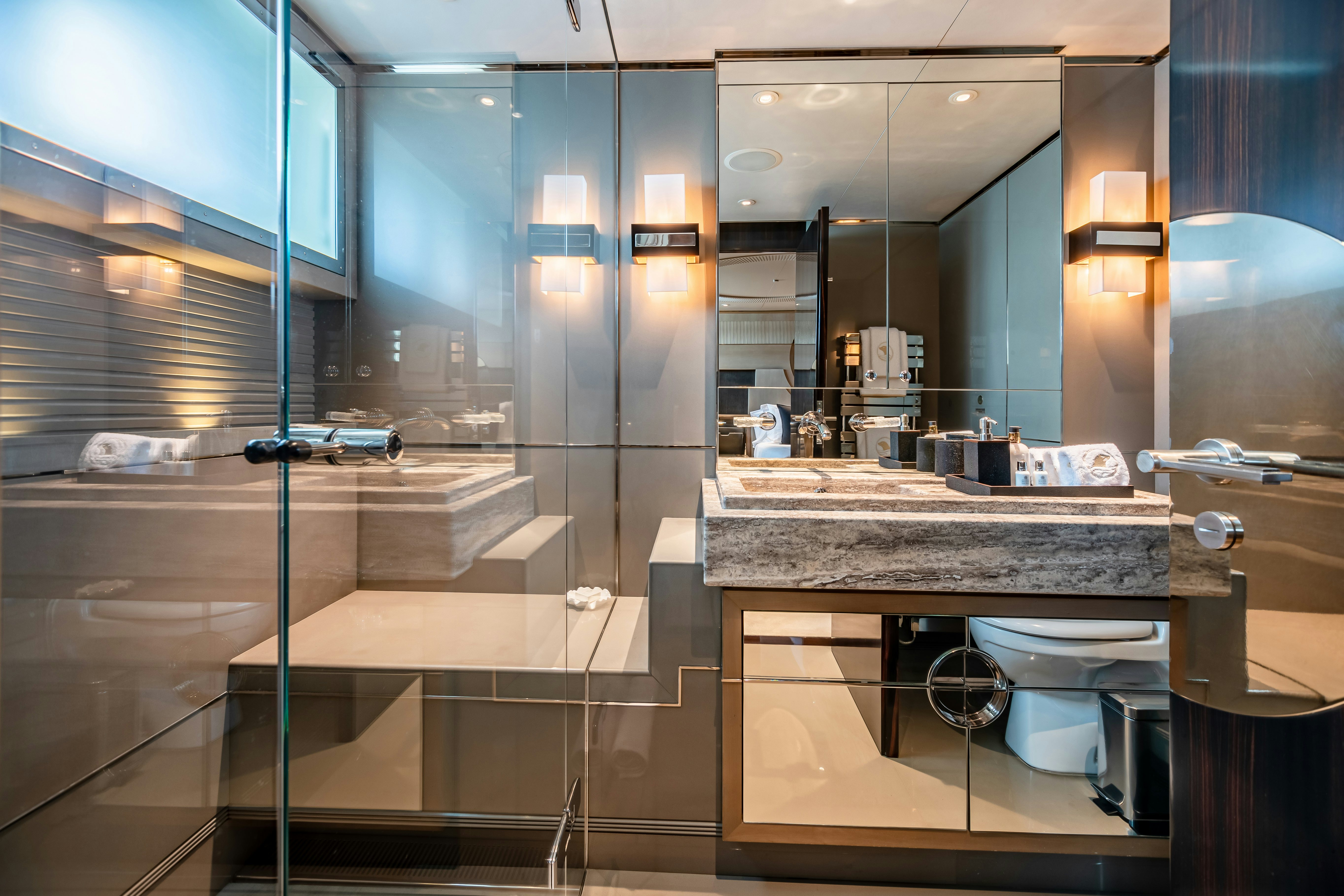 a bathroom with a glass wall aboard SEALION Yacht for Charter