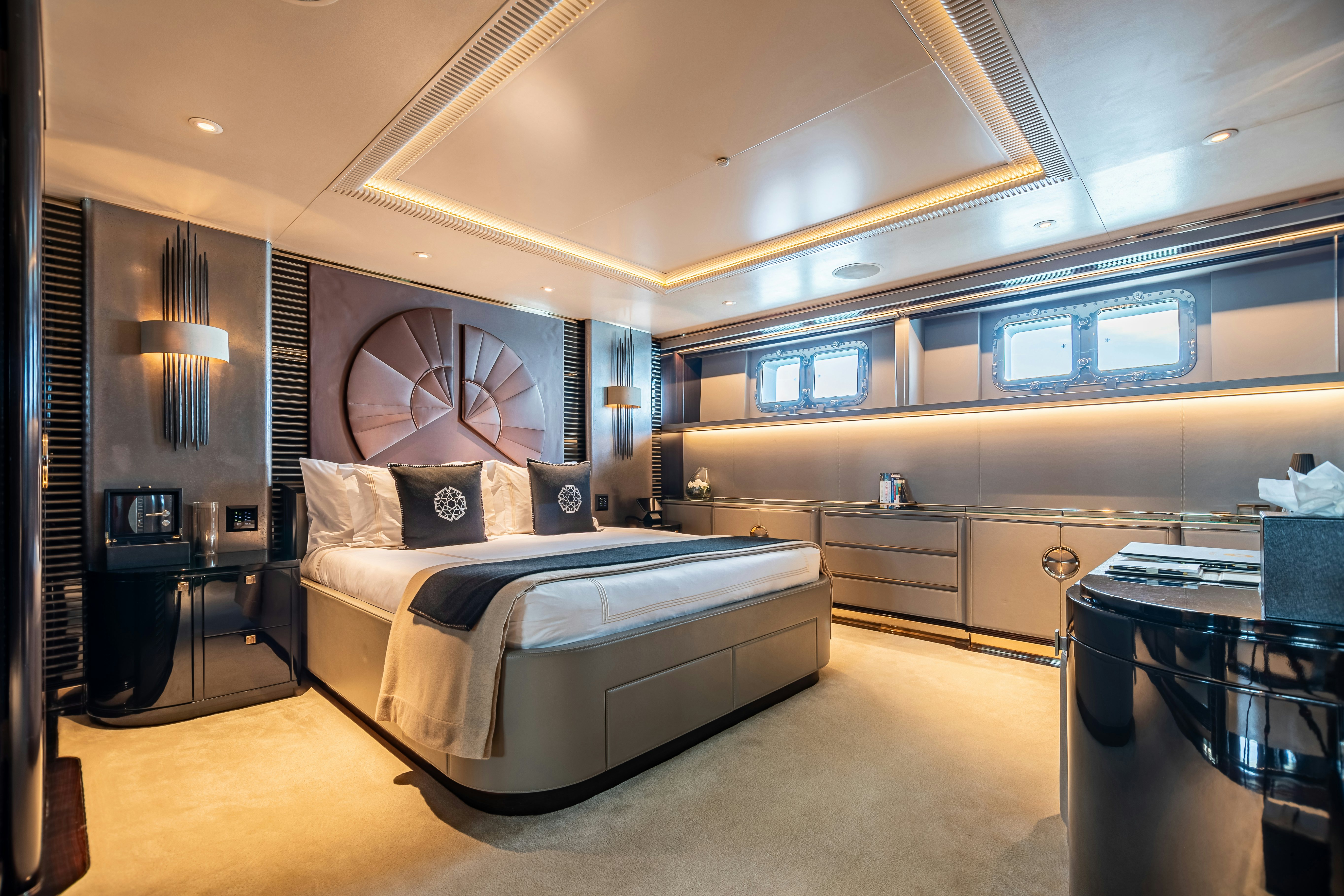 a bedroom with a large bed aboard SEALION Yacht for Charter
