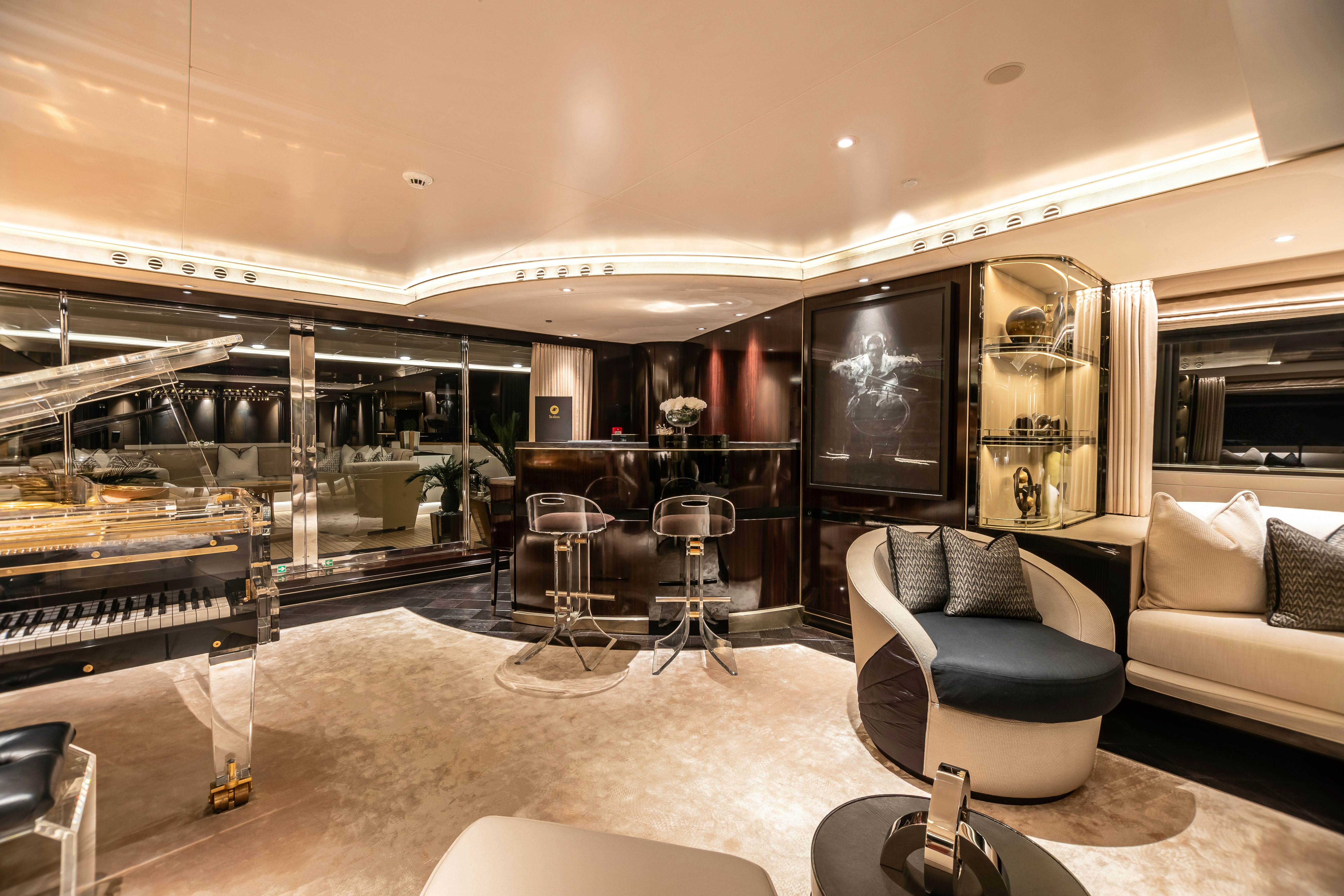 a living room with a large glass wall aboard SEALION Yacht for Charter