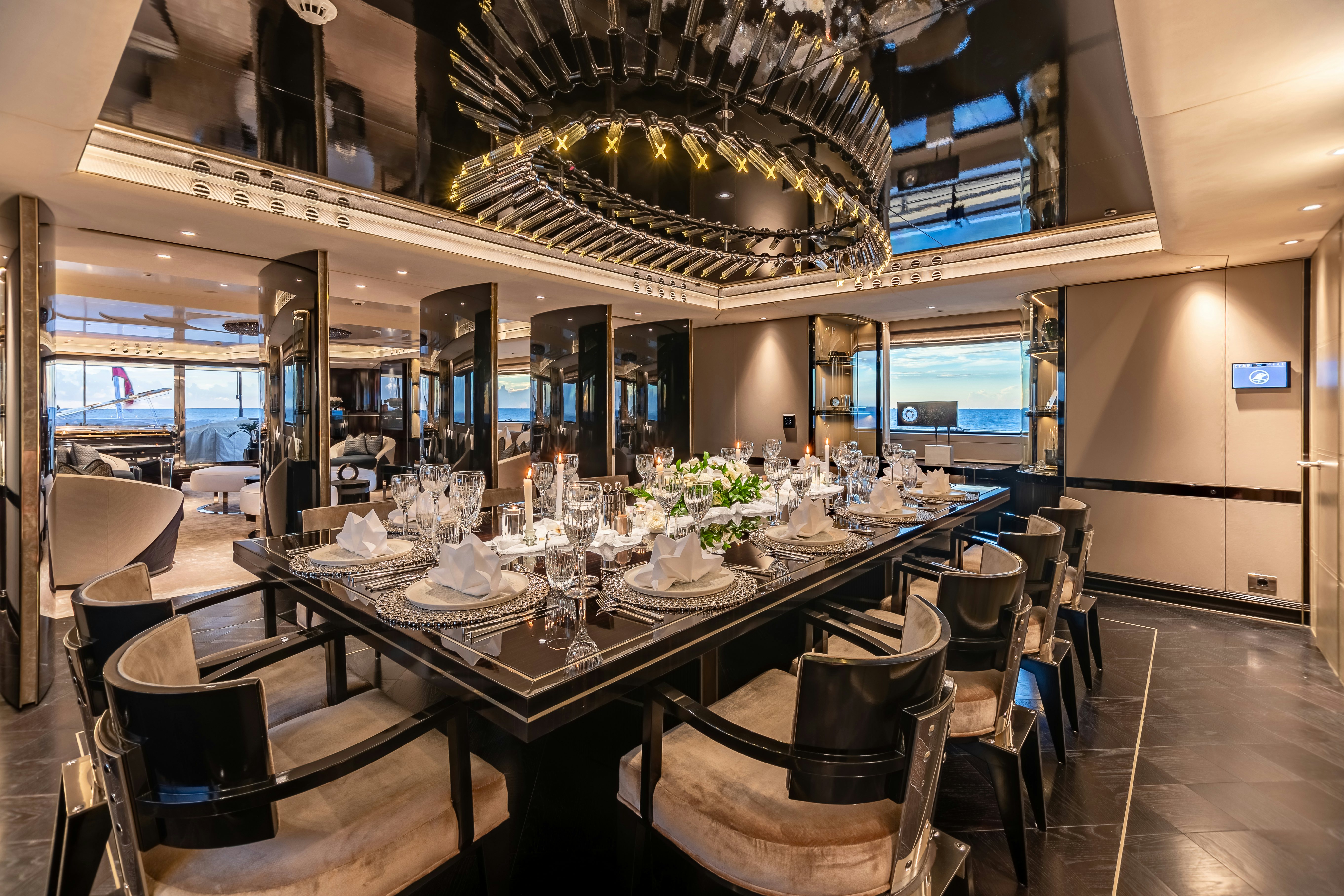 a large dining table in a restaurant aboard SEALION Yacht for Charter