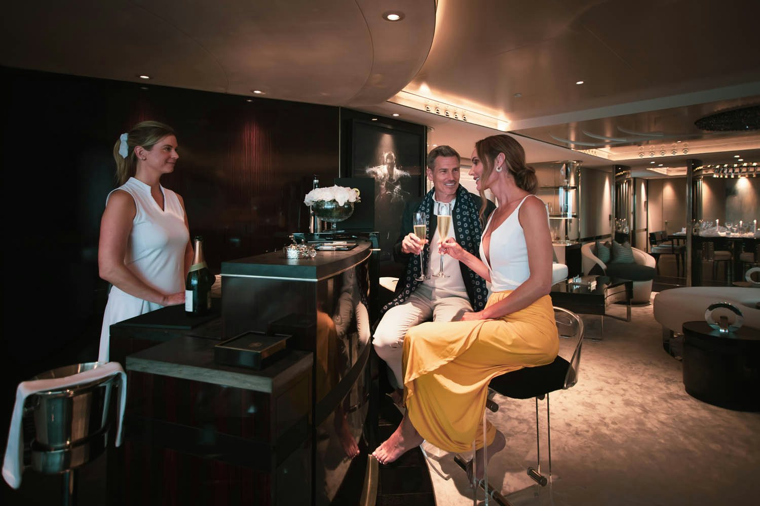 a group of people sitting in a bar aboard SEALION Yacht for Charter