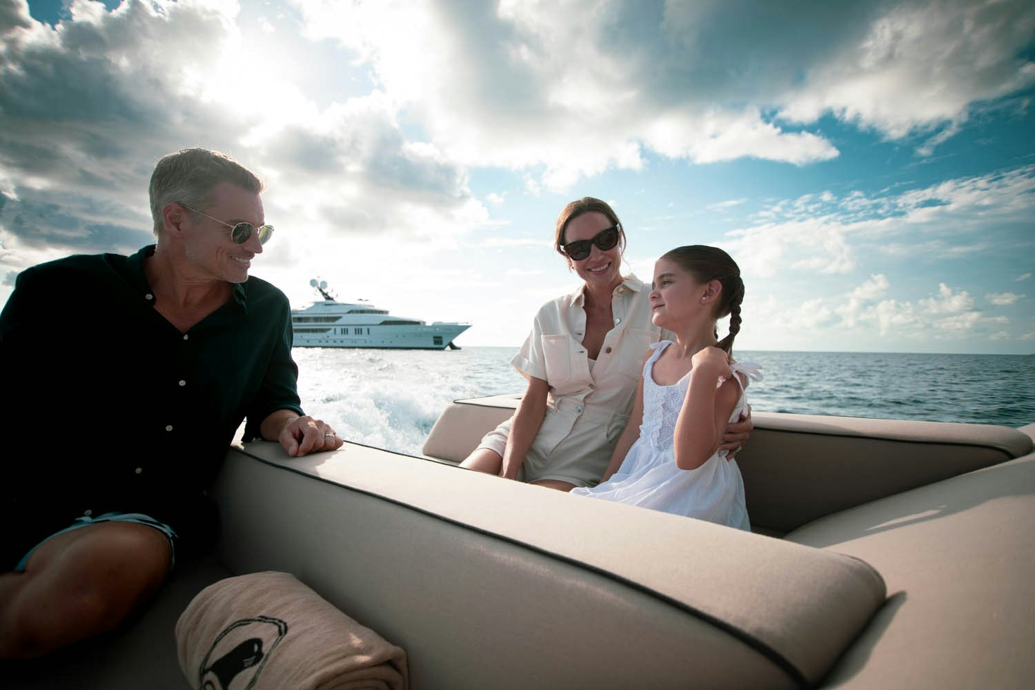 a group of people sitting on a boat aboard SEALION Yacht for Charter