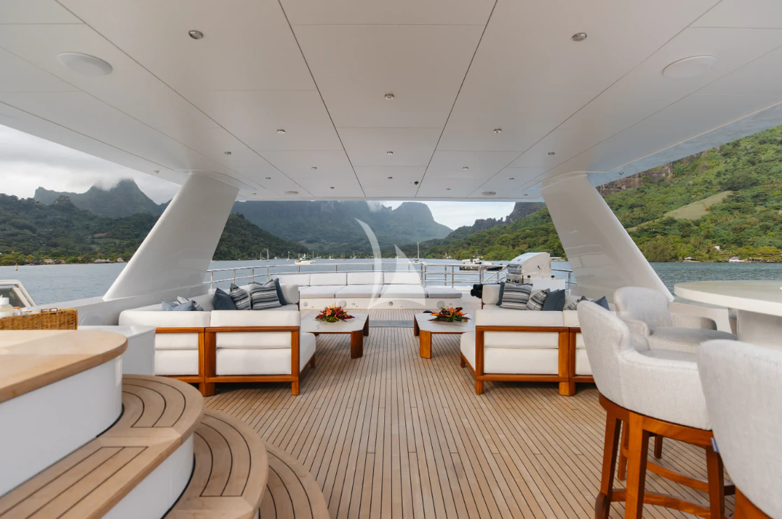 a room with a view of a lake and mountains aboard LIMITED RISKS Yacht for Charter