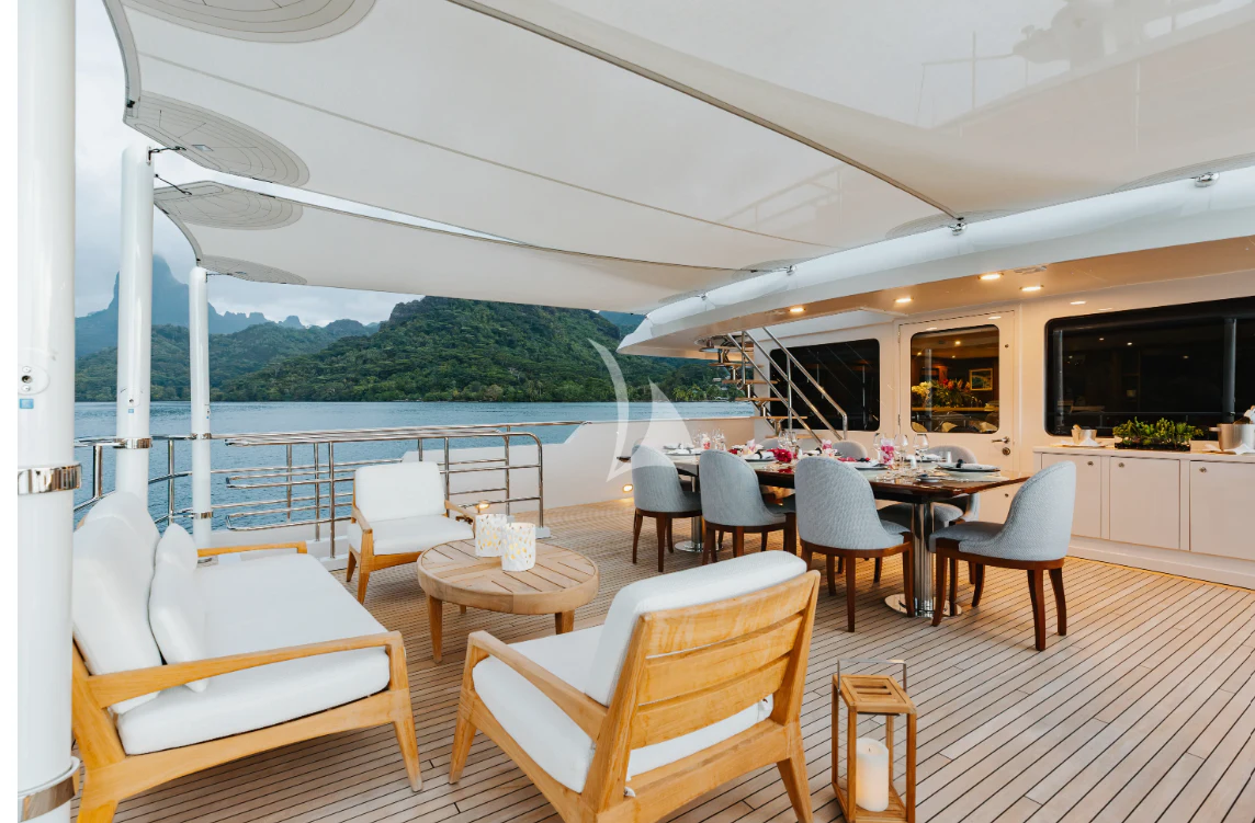 a room with a table and chairs aboard LIMITED RISKS Yacht for Charter