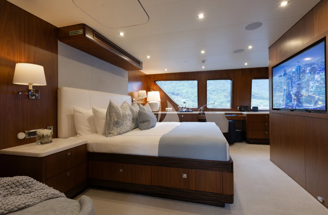 a large bedroom with a large bed aboard LIMITED RISKS Yacht for Charter