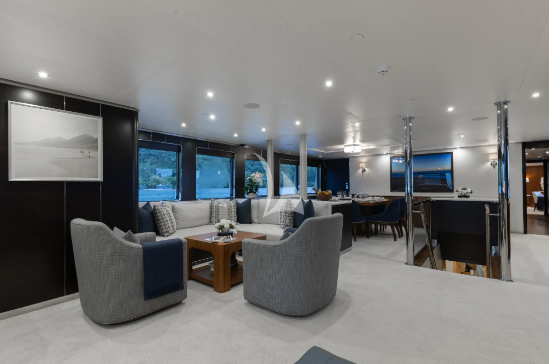 a room with a couch and a table and chairs aboard LIMITED RISKS Yacht for Charter