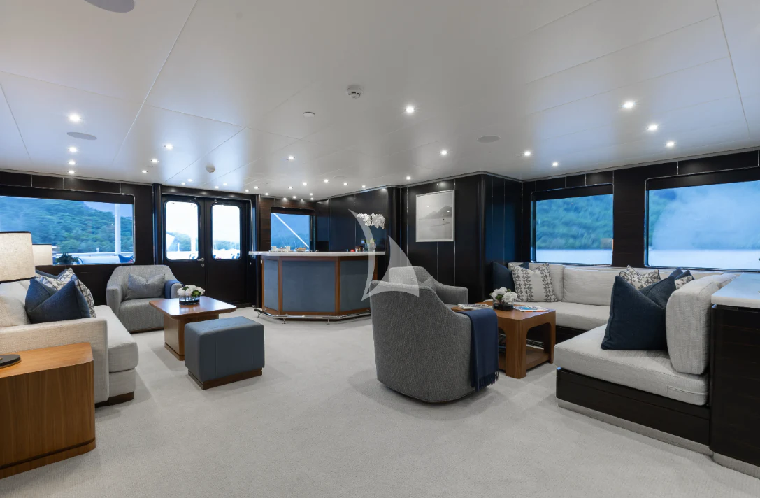 a large living room with a large window aboard LIMITED RISKS Yacht for Charter