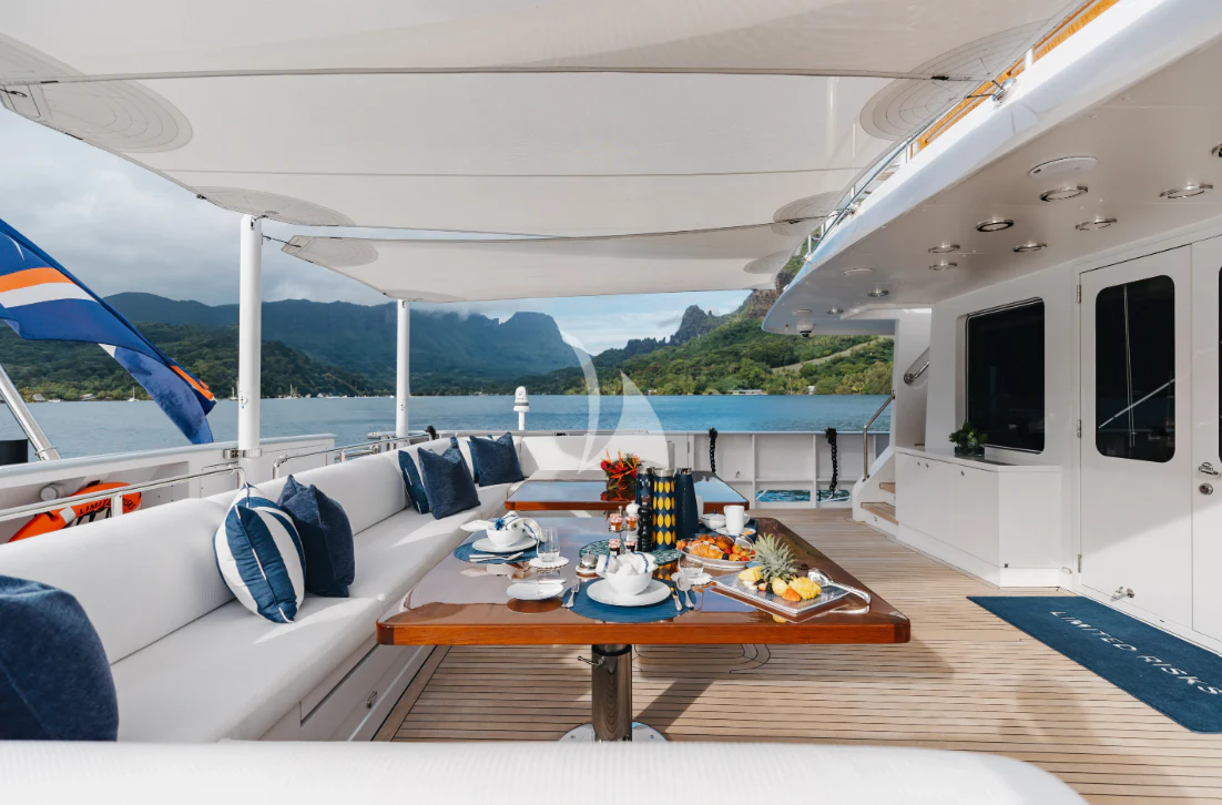a table on a boat aboard LIMITED RISKS Yacht for Charter