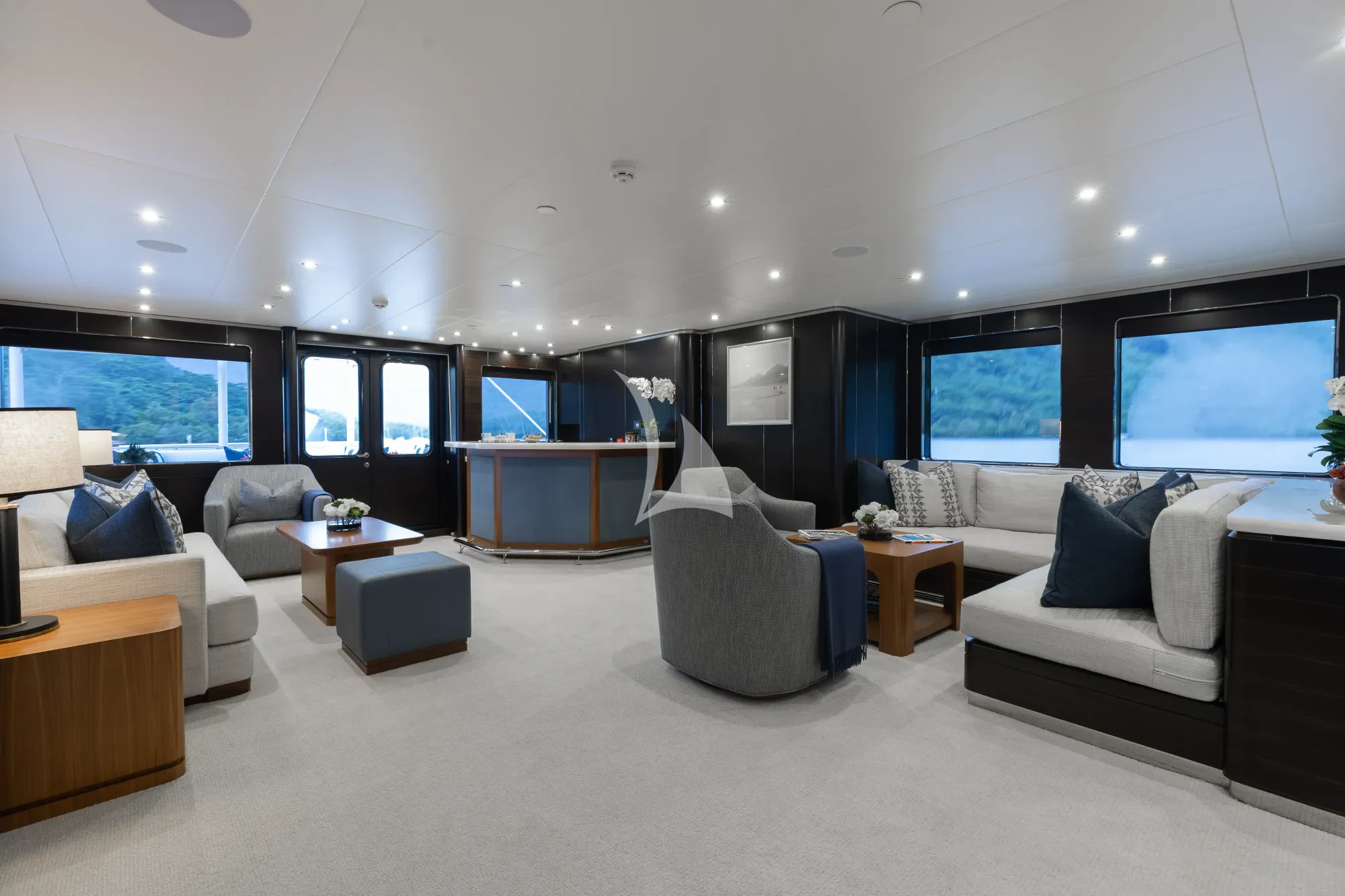 a large living room with a large window aboard LIMITED RISKS Yacht for Charter