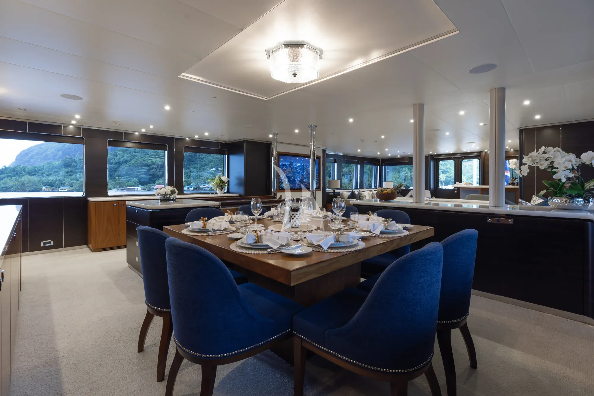 a large dining room with a large table and chairs aboard LIMITED RISKS Yacht for Charter