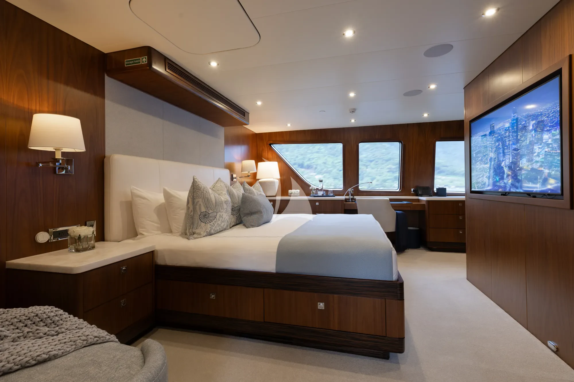 a room with a bed and a desk aboard LIMITED RISKS Yacht for Charter