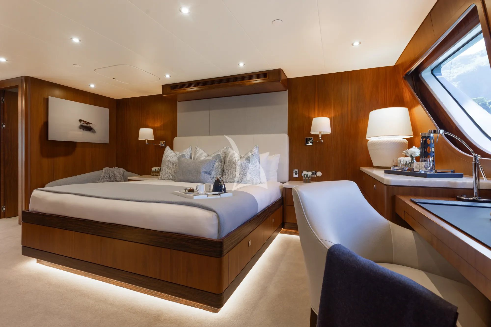 a hotel room with a bed and a desk aboard LIMITED RISKS Yacht for Charter