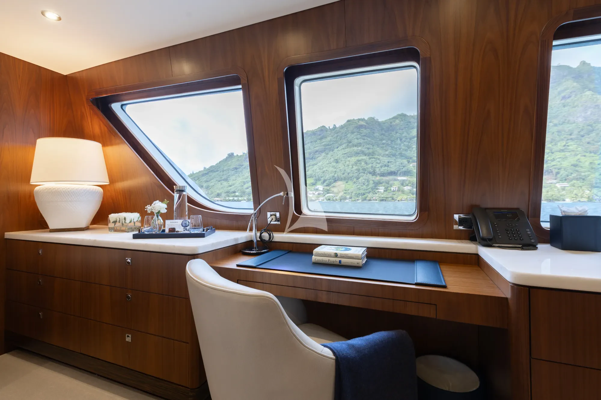 a room with a desk and a window aboard LIMITED RISKS Yacht for Charter