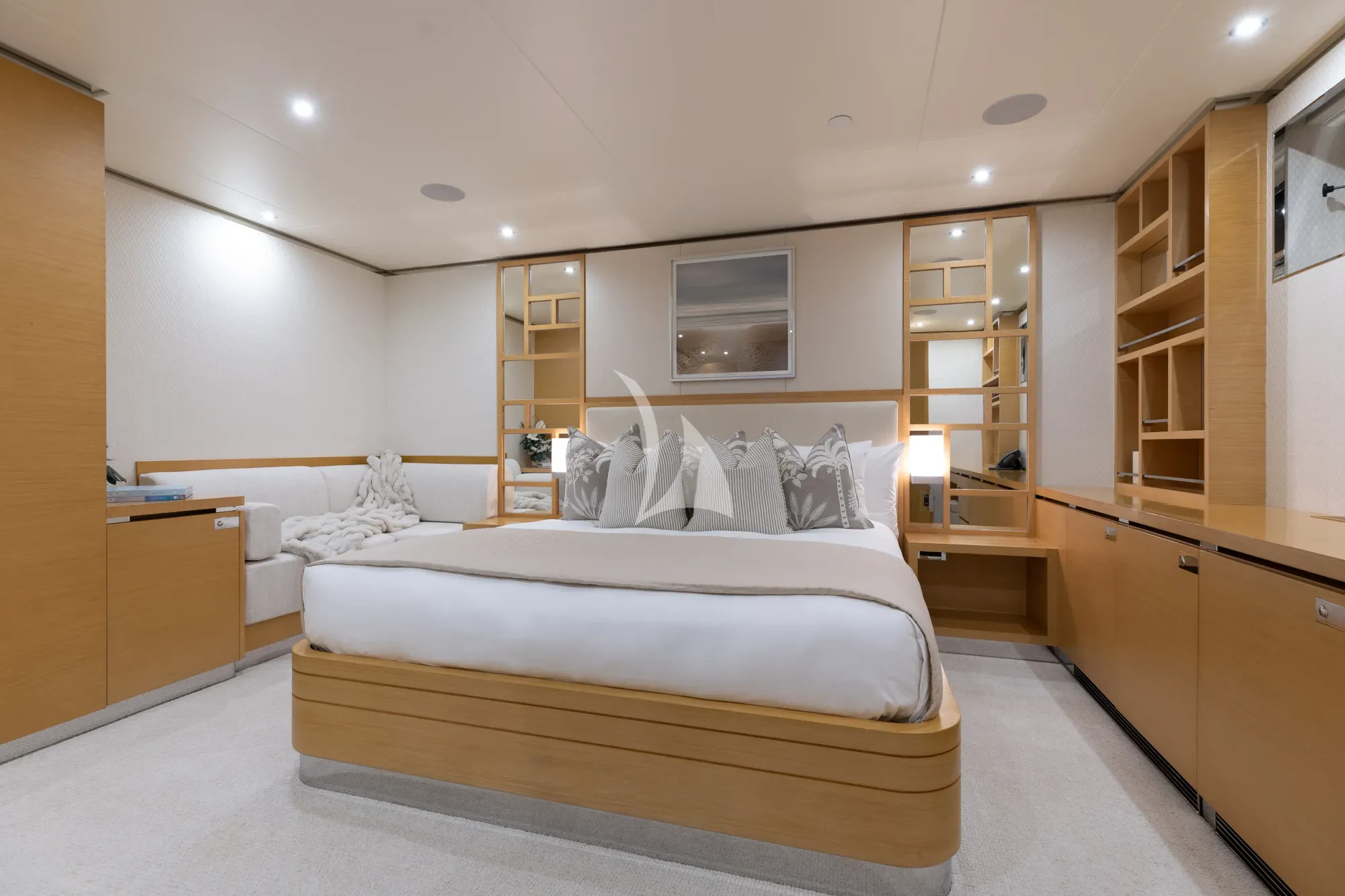 a bedroom with a bed and a mirror aboard LIMITED RISKS Yacht for Charter